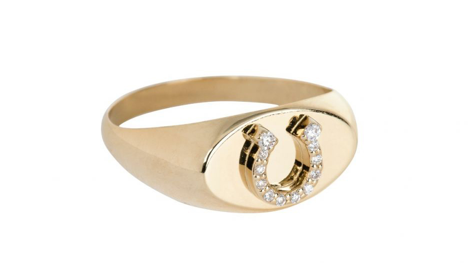 Round cut diamonds set in a horseshoe pendant signet ring with a gold band from Foundrae