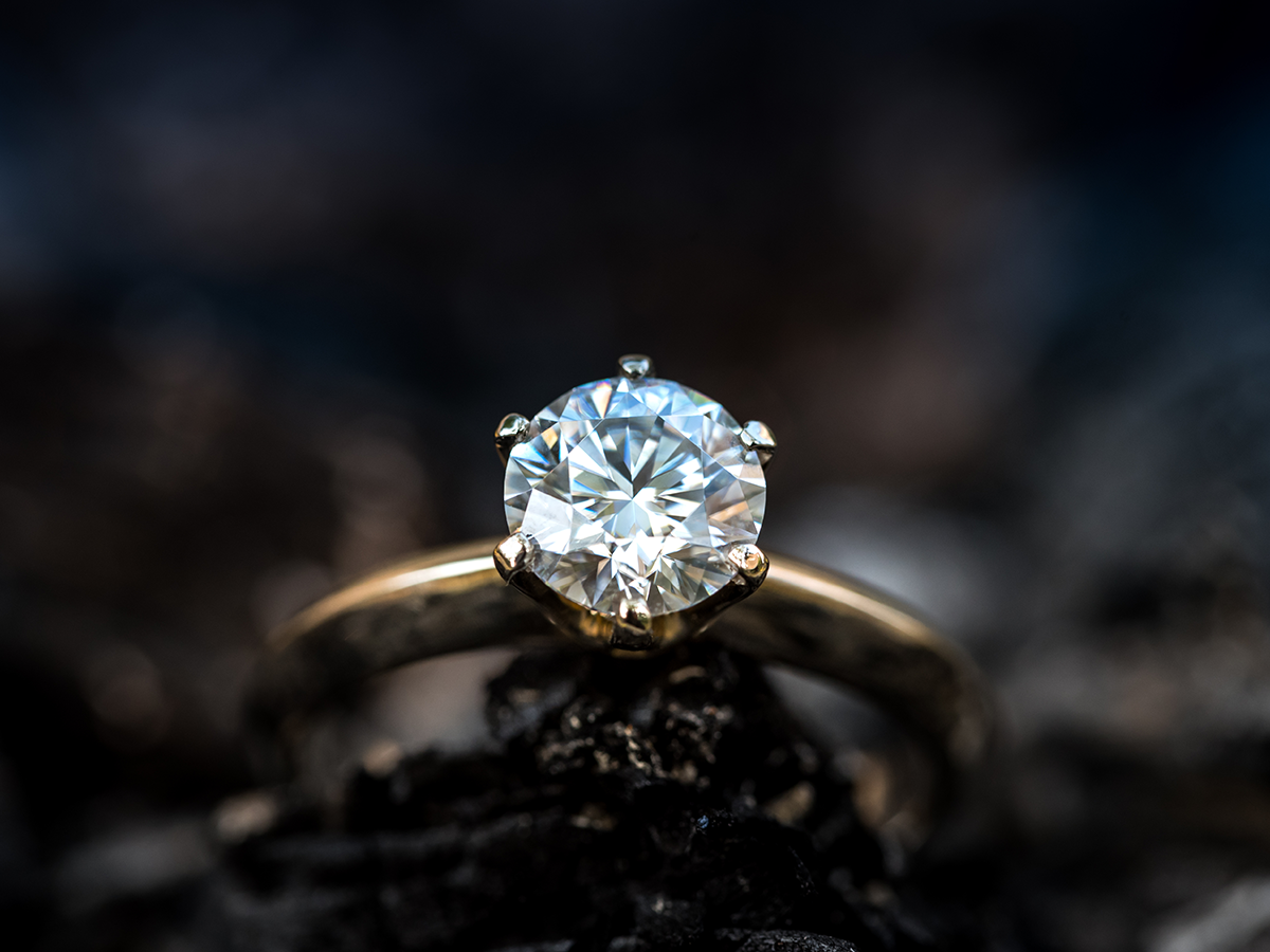 Classic round cut diamond engagement ring with yellow gold band