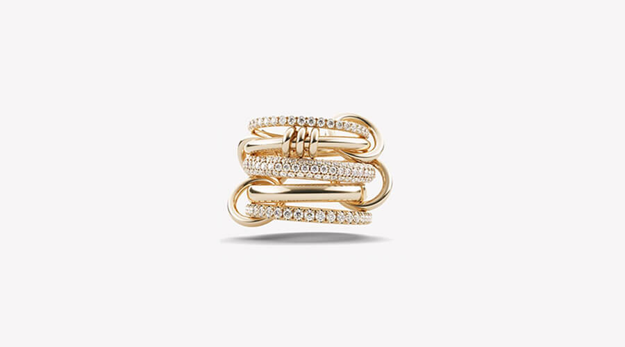Interlocking ring with 2 gold and 3 pave diamond bands from Spinelli Kilcolli