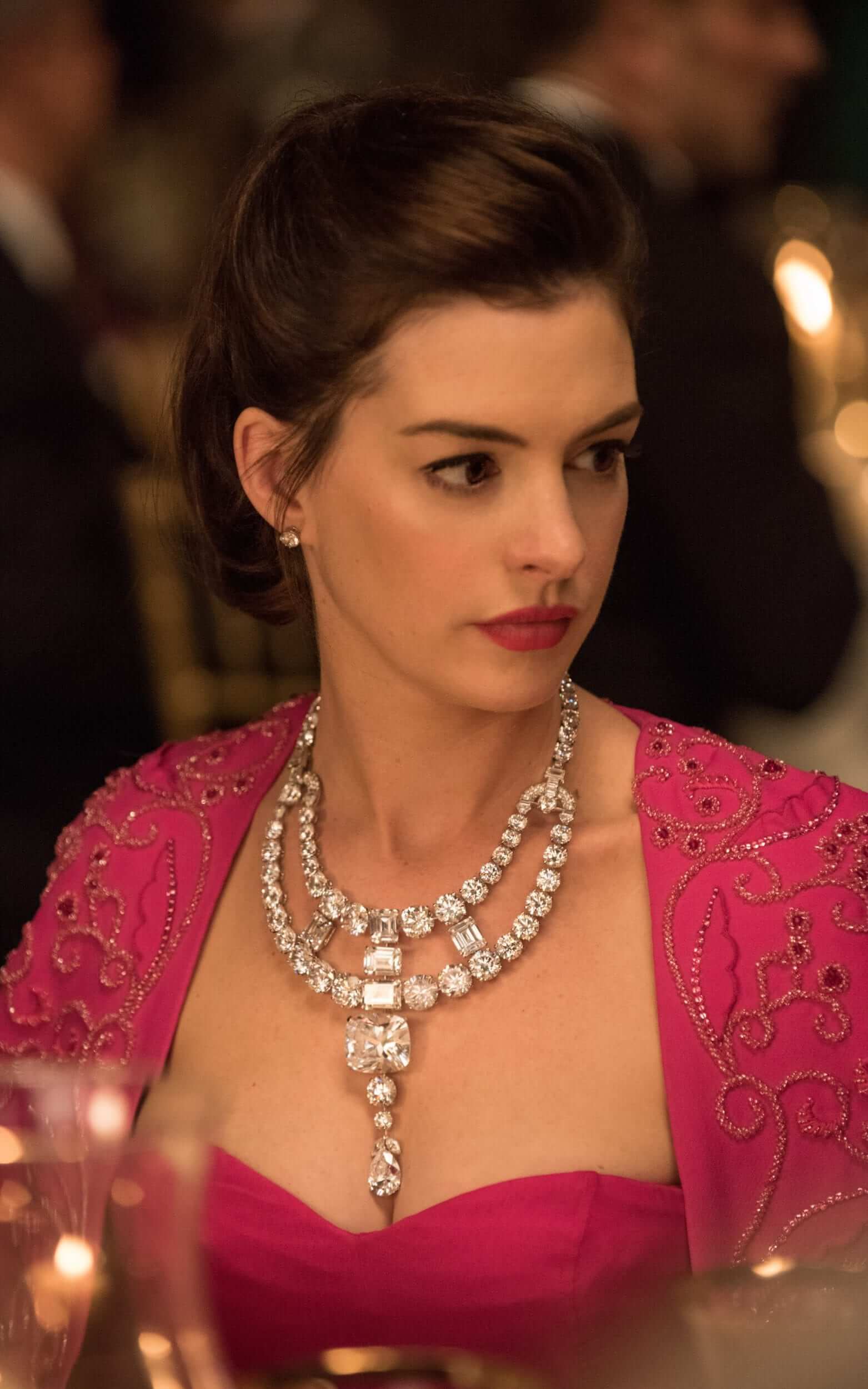Actress Anne Hathaway wearing the Jeanne Toussaint necklace in Ocean's 8 featuring dozens of round and cushion cut diamonds which was reimagined from a historic diamond Cartier necklace