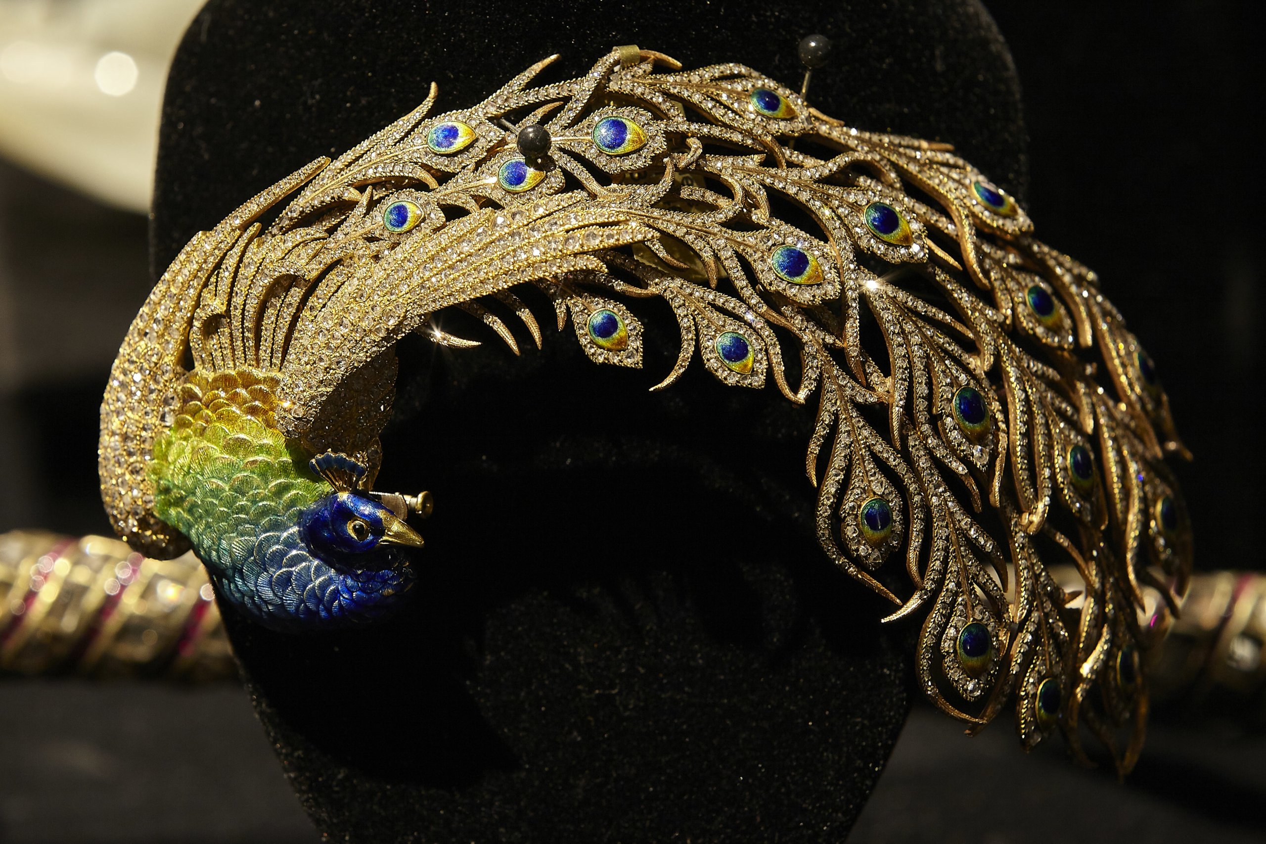 The Peacock brooch from an aigrette of yellow and gold, enamel and diamonds