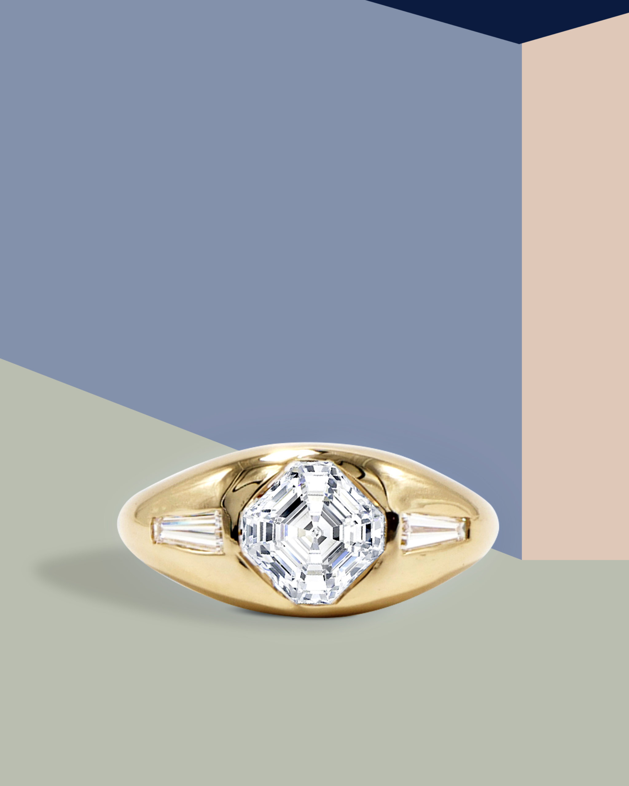 Dome-shaped gypsy engagement ring in yellow gold with a center Asscher cut diamond and two side baguette diamonds