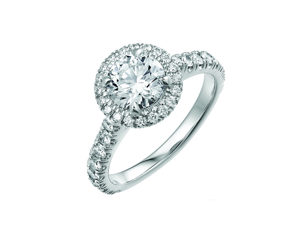 Classic round cut diamond engagement ring with a halo of diamonds and platinum diamond band