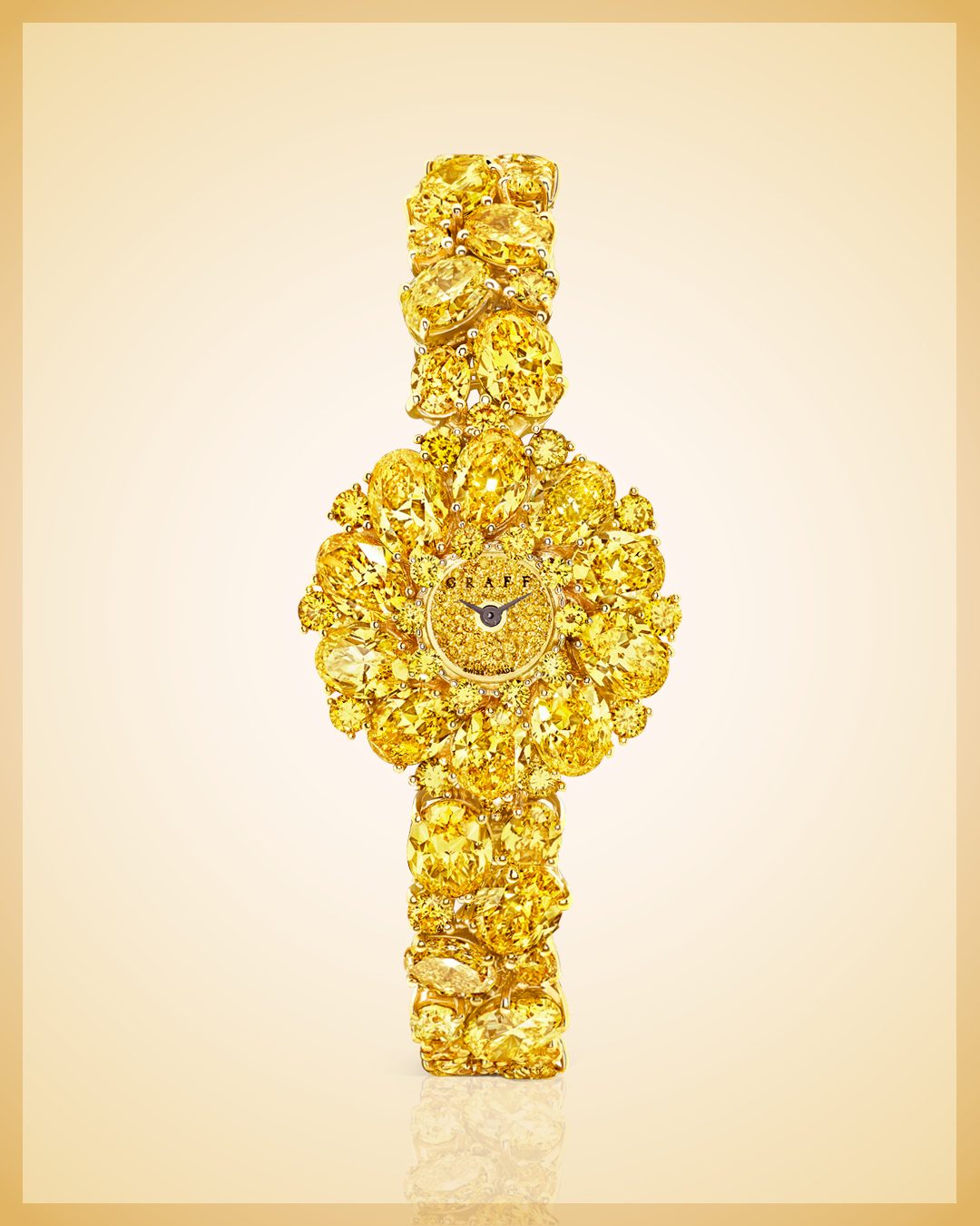 Graff diamond watch featuring fancy yellow diamonds throughout in varying cuts set it 18-karat yellow gold