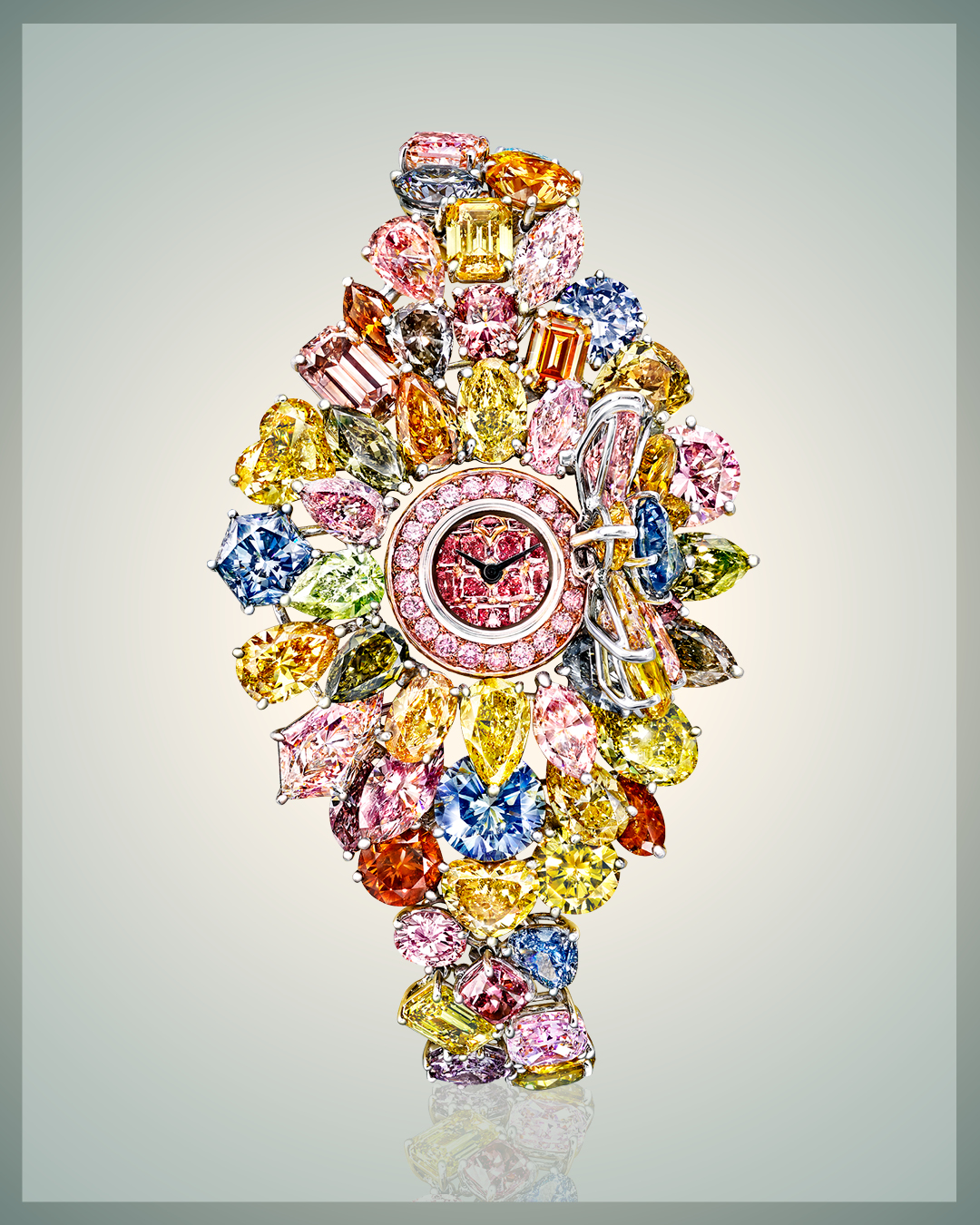 Graff Diamonds Hallucination watch featuring 110 carats worth of colored diamonds including a pink diamond face, and several different shades of blue diamonds, yellow diamonds, orange diamonds