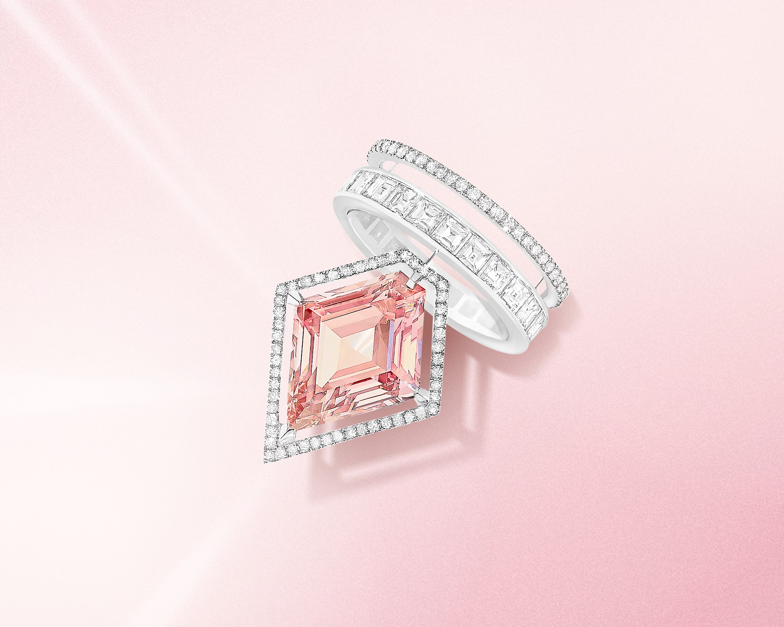 Kite cut pink diamond ring with the halo and 2 row pave diamond band