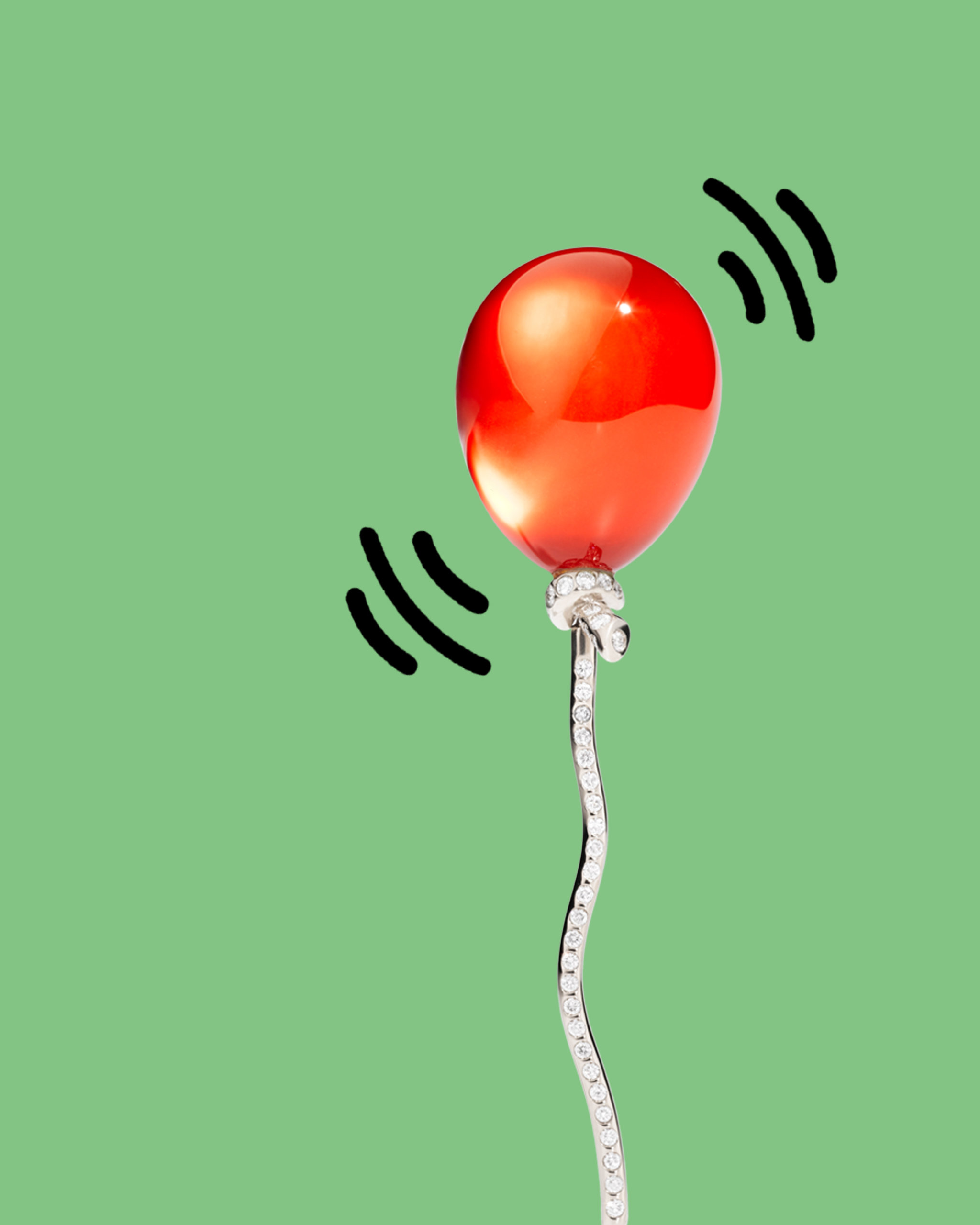 Pave diamond encrusted red balloon emoji pendant from Vhernier