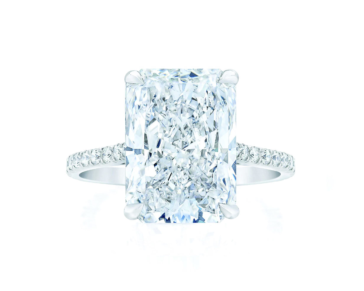 Radiant cut diamond center stone ring with platinum pave band