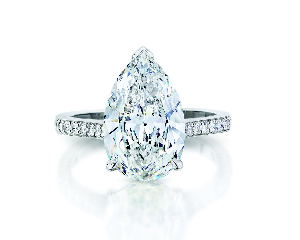 Pear cut diamond engagement ring with platinum pave band