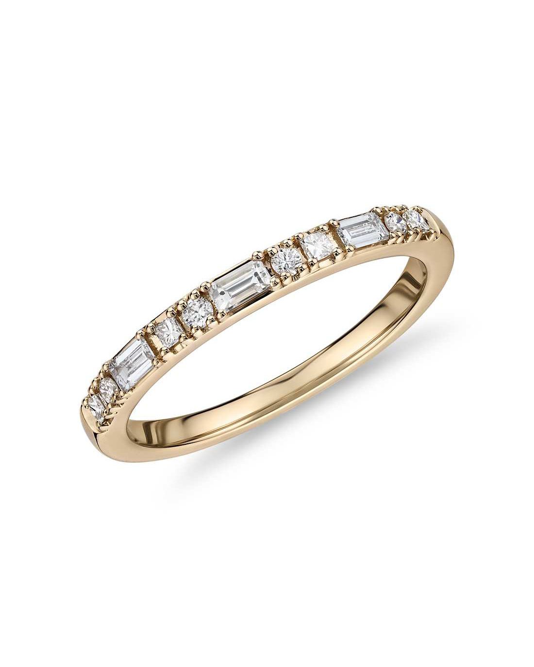 Round, baguette, and princess cut diamond ring set within 14k gold