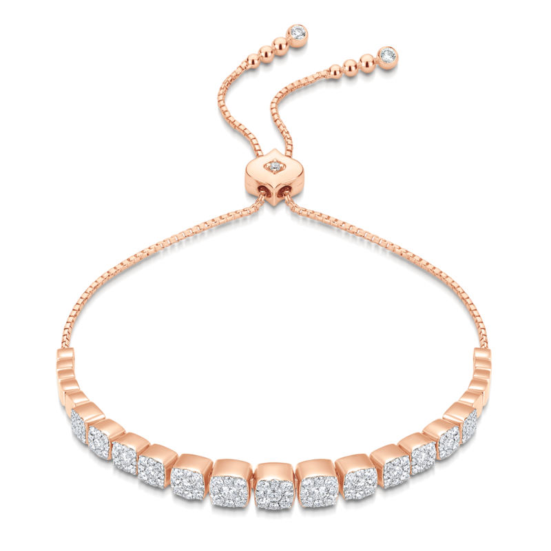 Clustered cushion cut diamond tennis bracelet in rose gold with diamond encrusted bolo closure