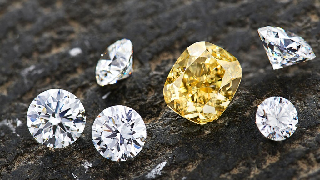 5 different round cut diamonds and 1 large rectangular cushion yellow diamond