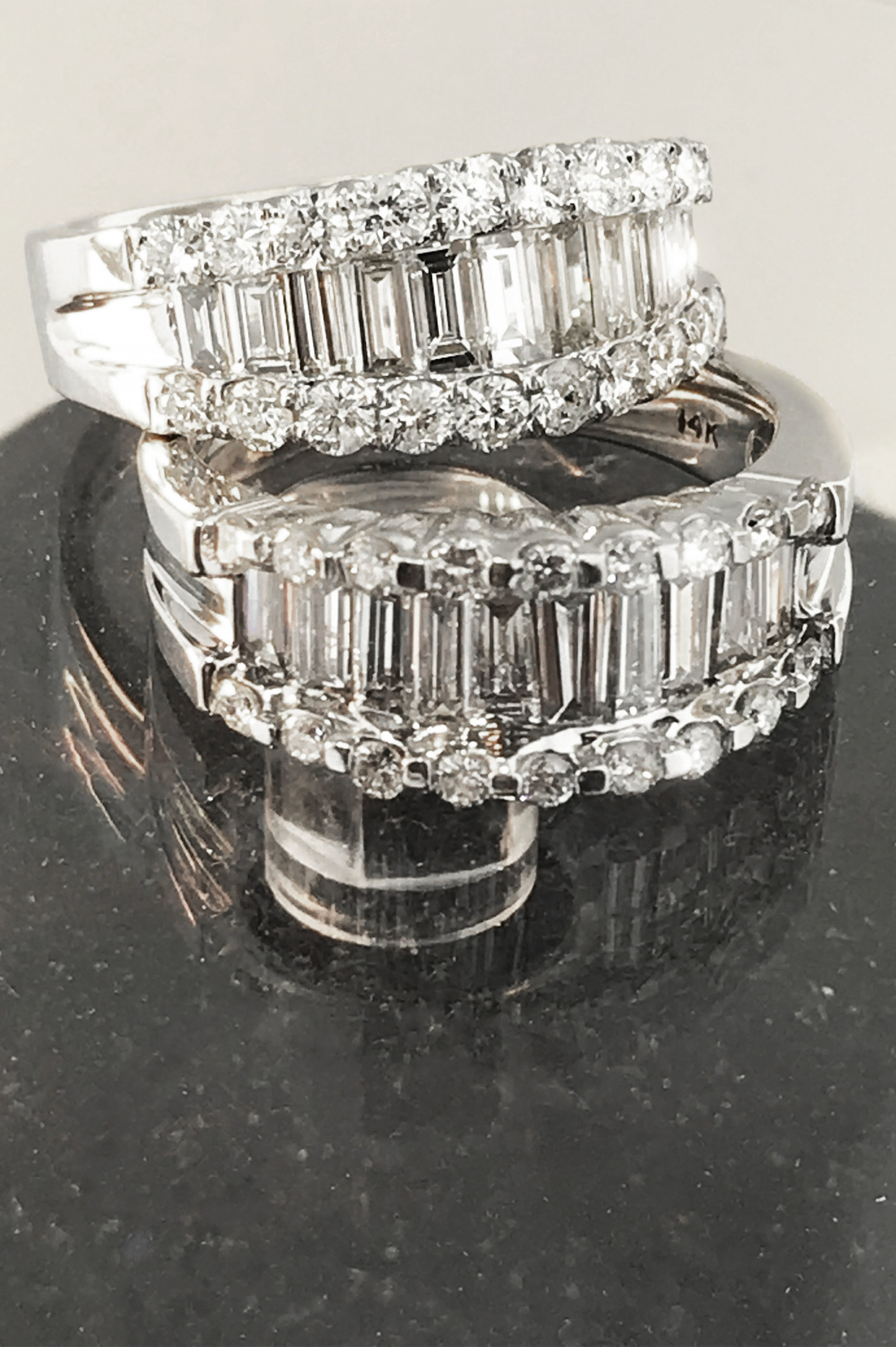 Up-close profile of the matching set of customized baguette diamond ring bands from Atlanta West Jewelry. 