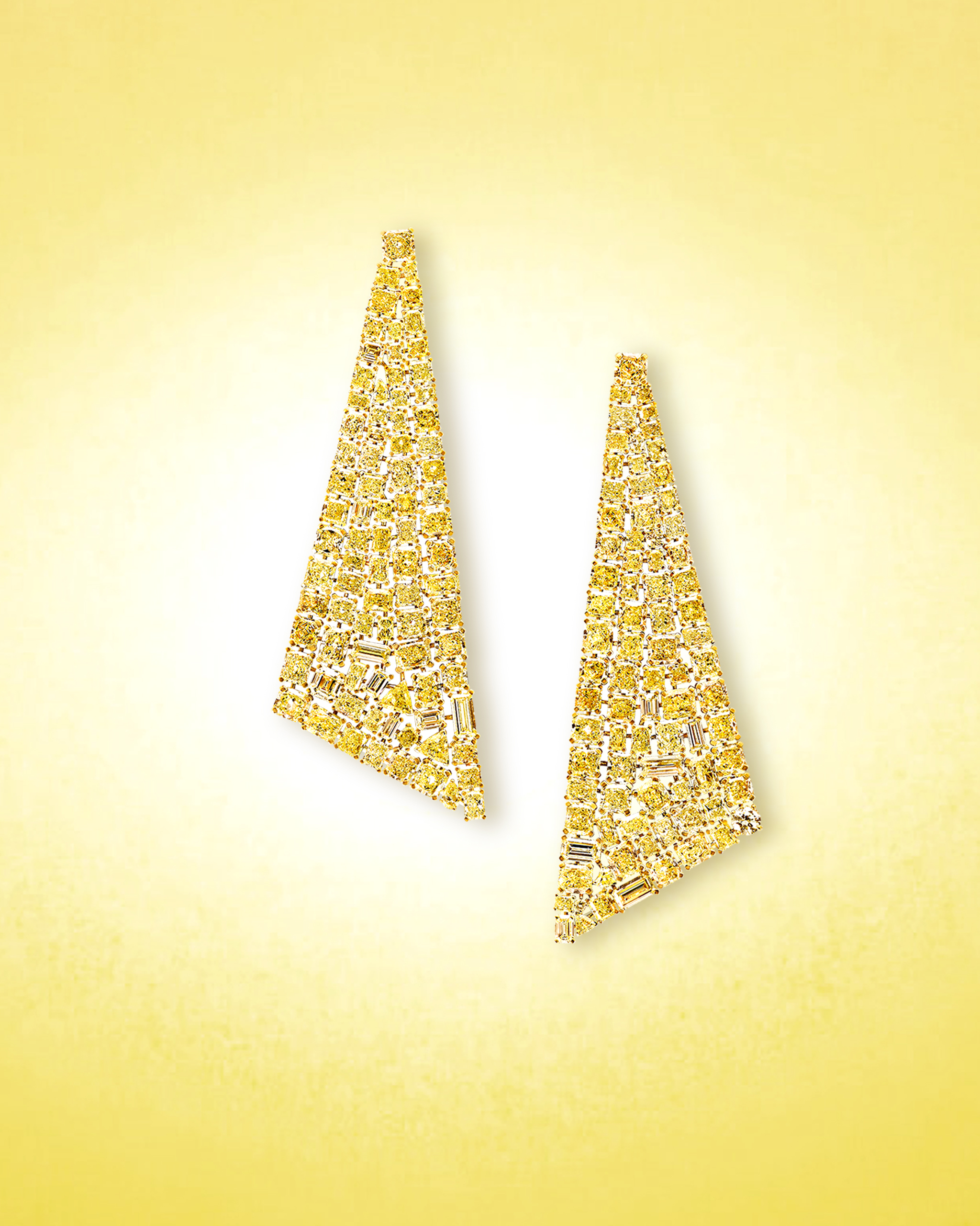Assorted yellow diamond cuts and baguette diamonds set within statement earrings