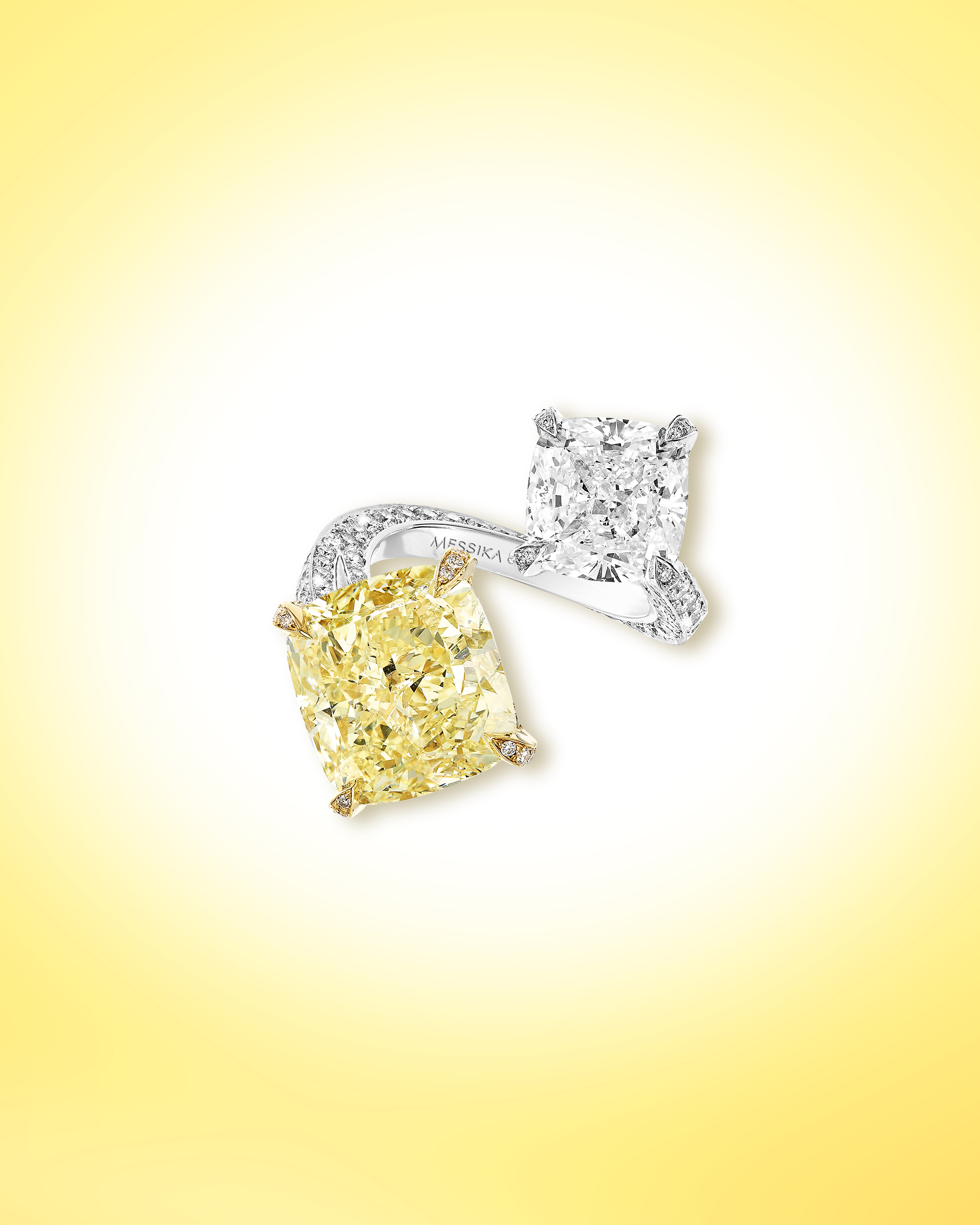 The Sun Kiss ring: cushion cut yellow & white diamonds ring in a toi et moi setting on a platinum band from Messika