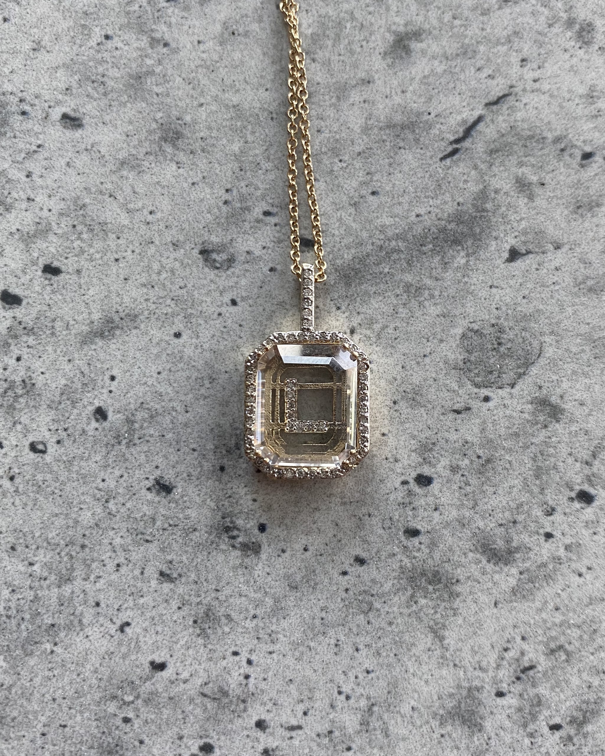Pave diamond initial pendant necklace from Mateo New York with the letter "L" for Law Roach