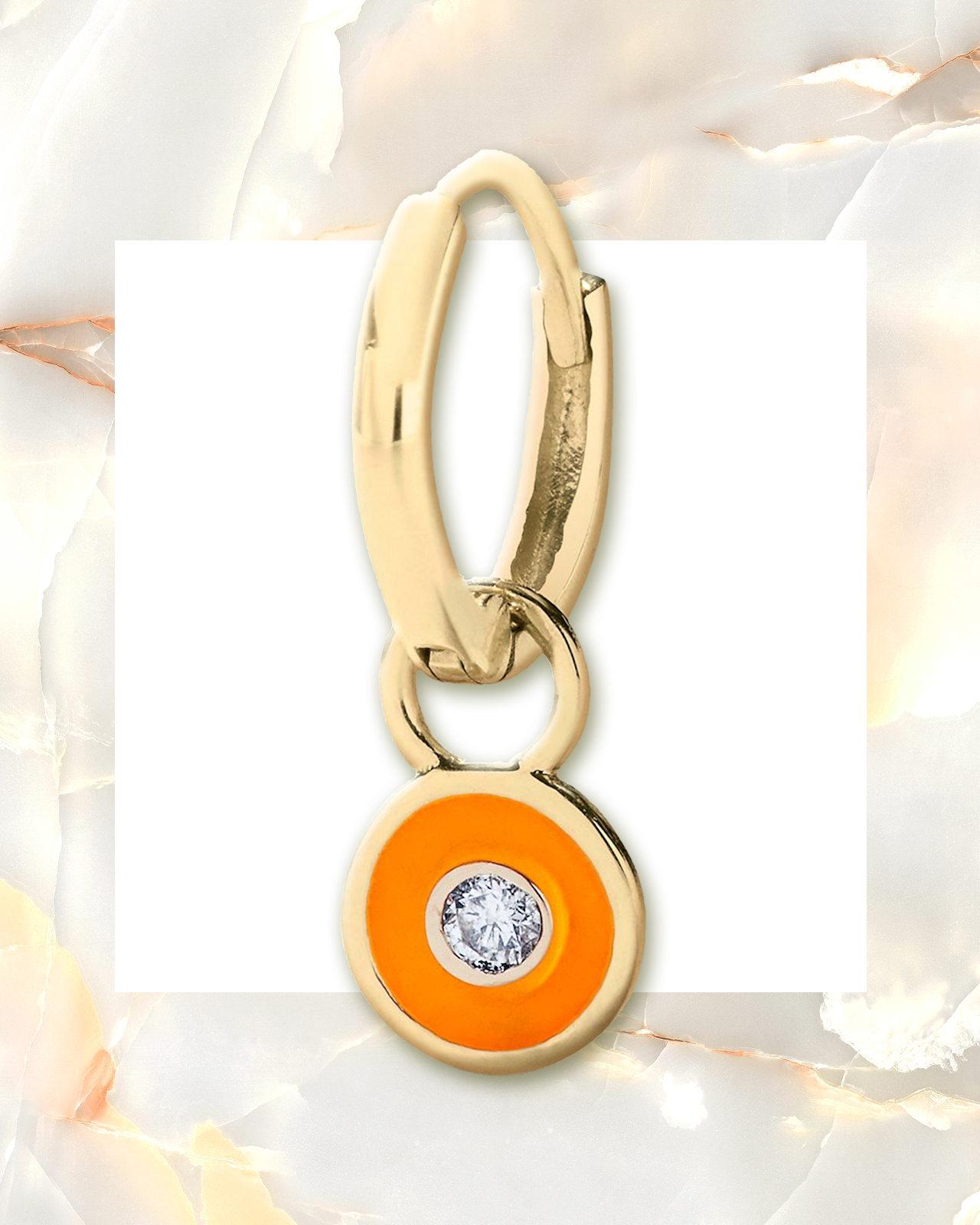 Single round cut diamond centered in an orange enamel pendant comprised of yellow gold from Alison Lou
