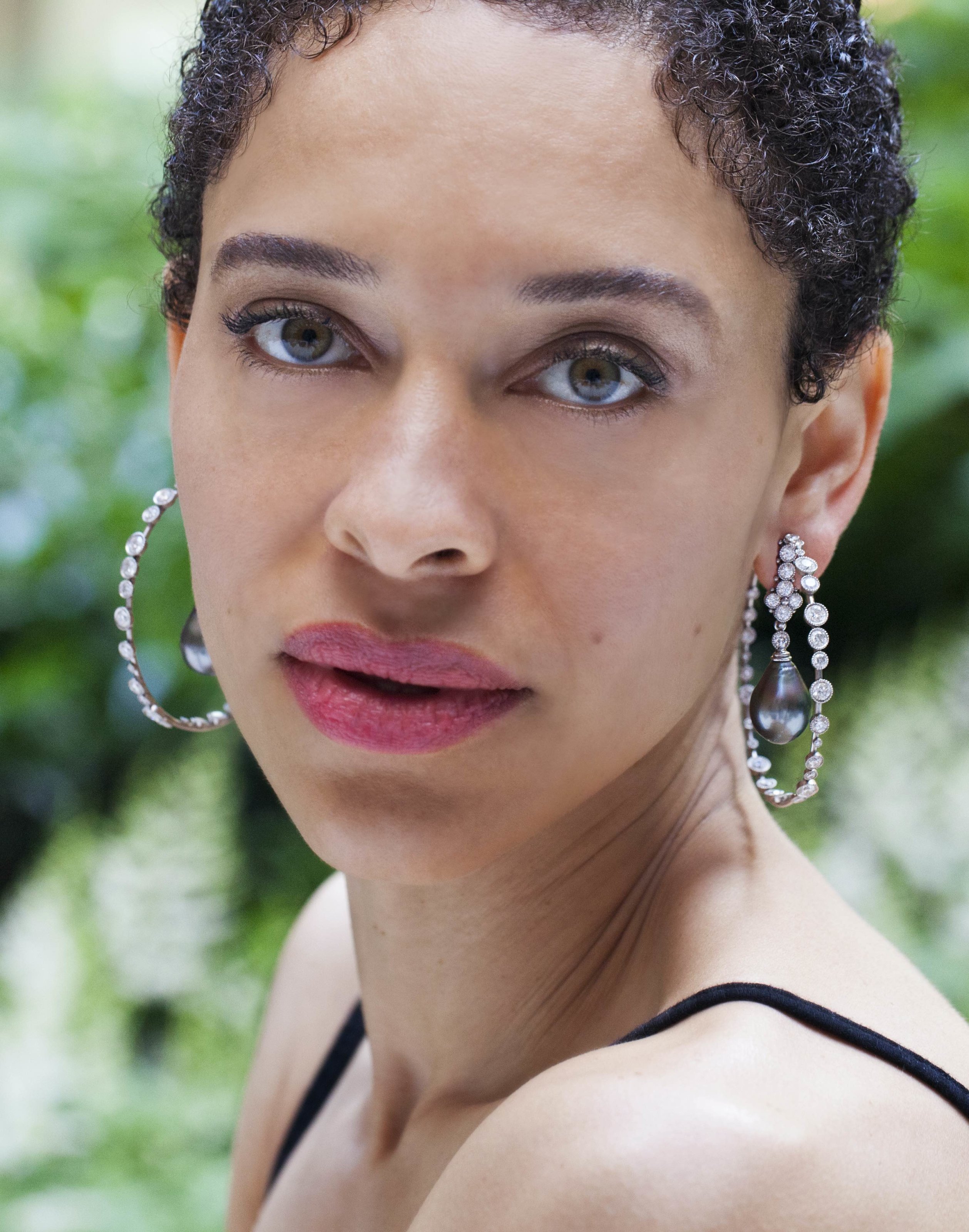 Large diamond hoop earrings set in platinum with large pearl pendant in the center from Deirdre Featherstone of Featherstone Fine Jewelry