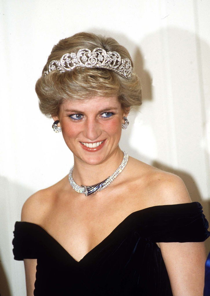 Princess Diana wearing the Spencer Tiara, a sapphire and diamond necklace paired with diamond hoop earrings