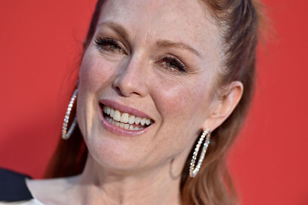Julianne Moore red carpet look featuring large diamond hoop earrings paired with a black and white Givenchy cocktail dress at the premiere of her film Suburbicon in 2017