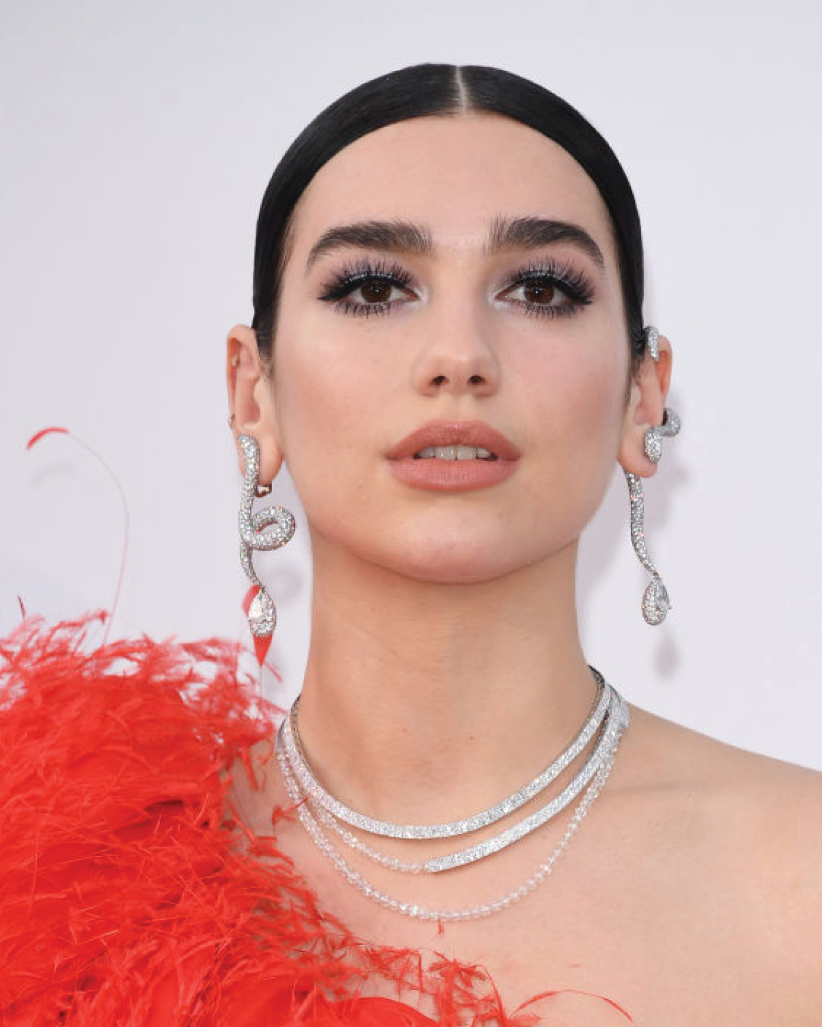 Dua Lipa mismatched earrings