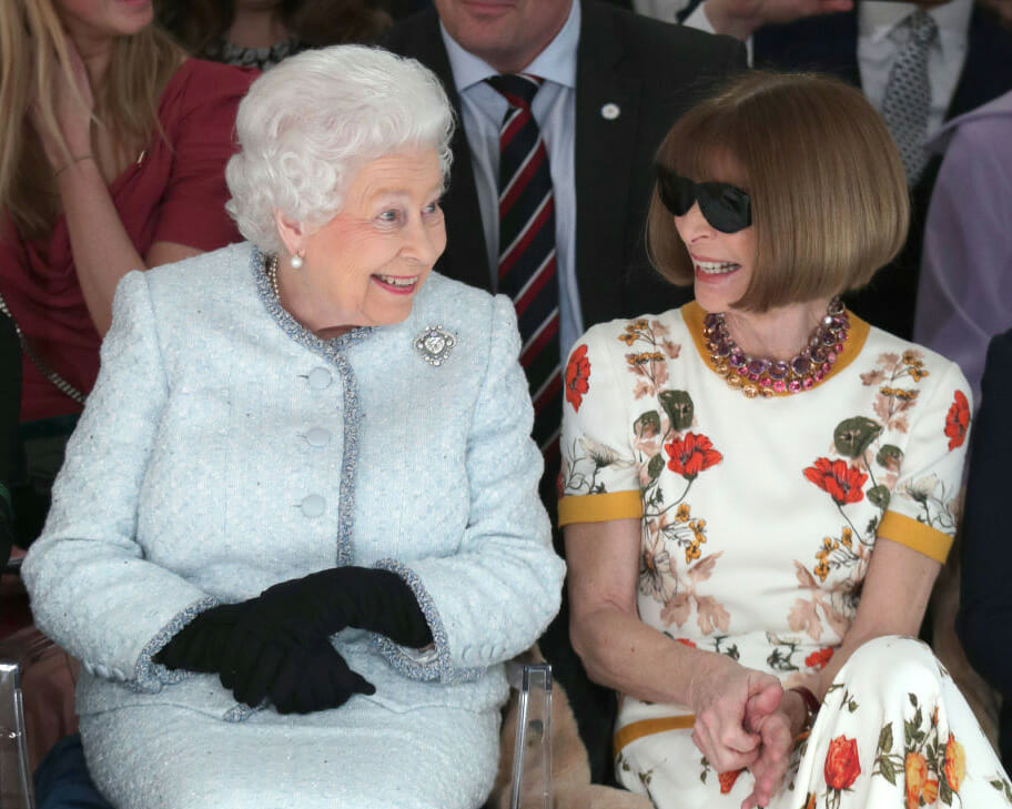 Queen Elizabeth and Anna Wintour at fashion show.