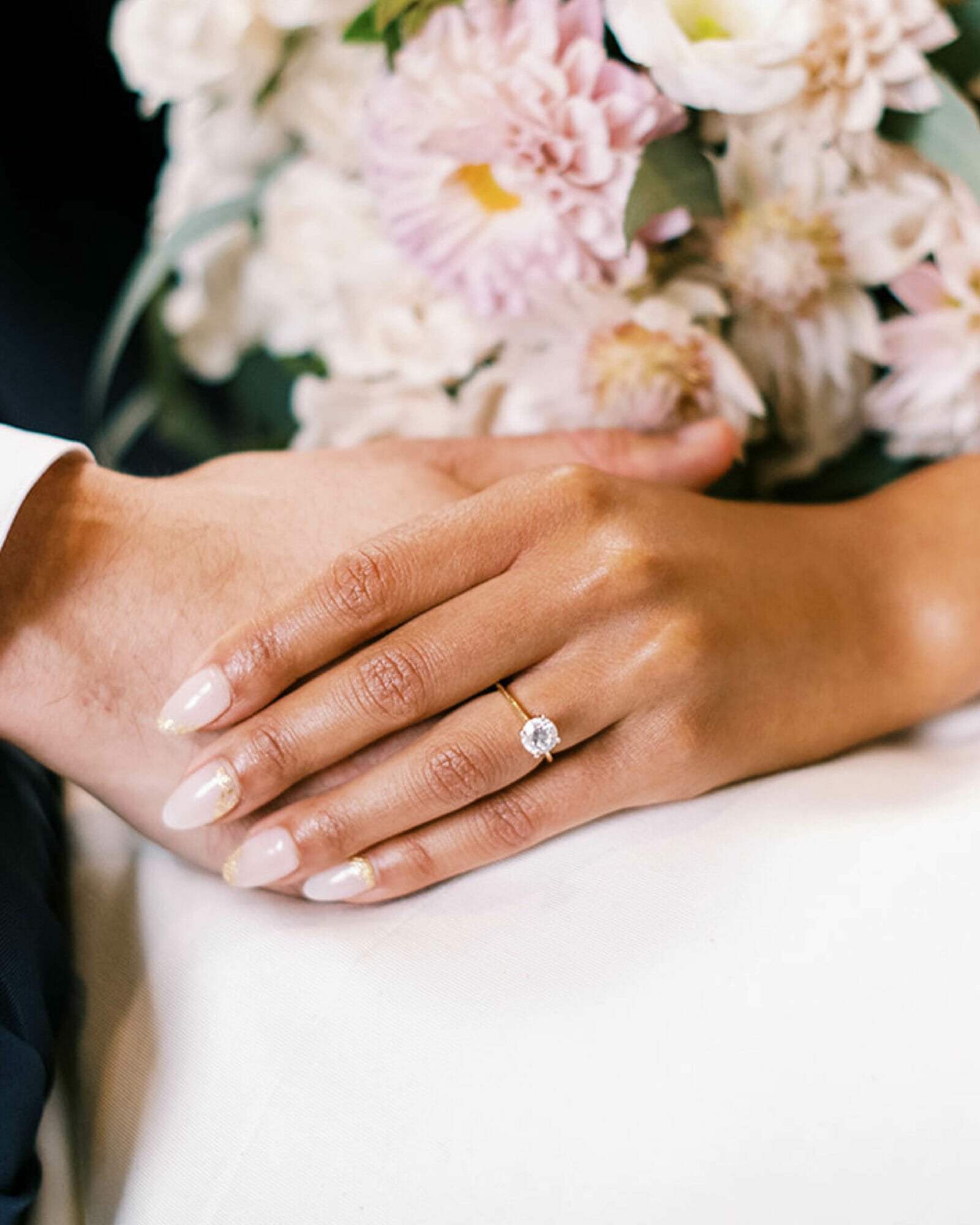 Camille Sold flashes her diamond engagement ring as she indulges