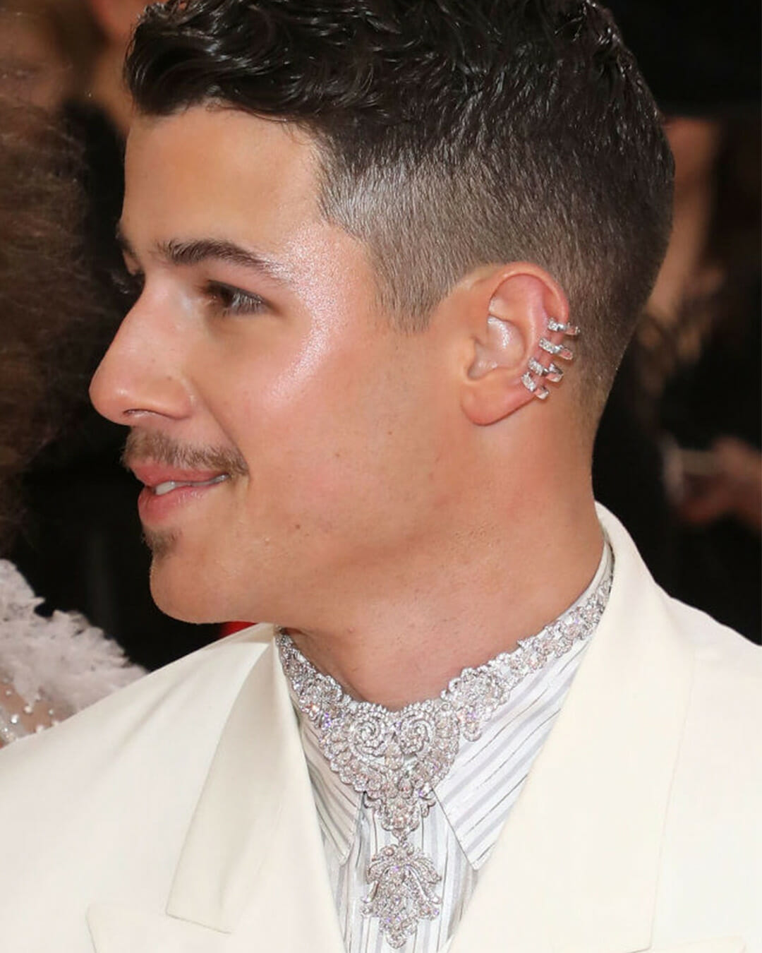 Nick Jonas wearing diamond jewelry