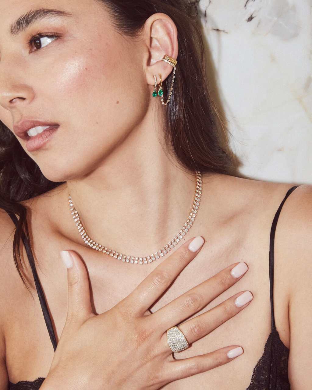 Model wearing diamond necklace, ring and earring by Asian American designer Anita Ko