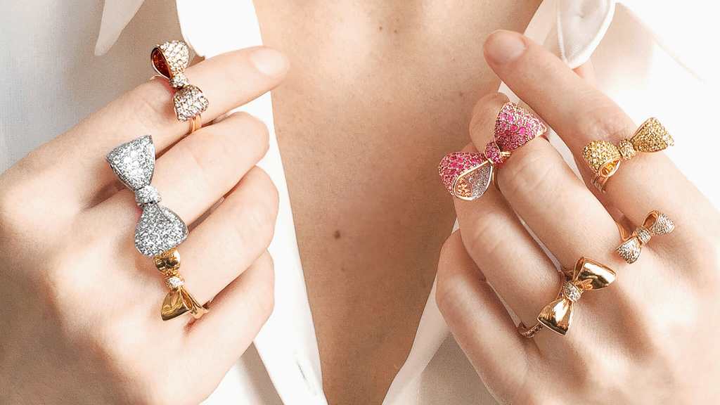 Model wearing bow-shaped diamond rings by Mimi So