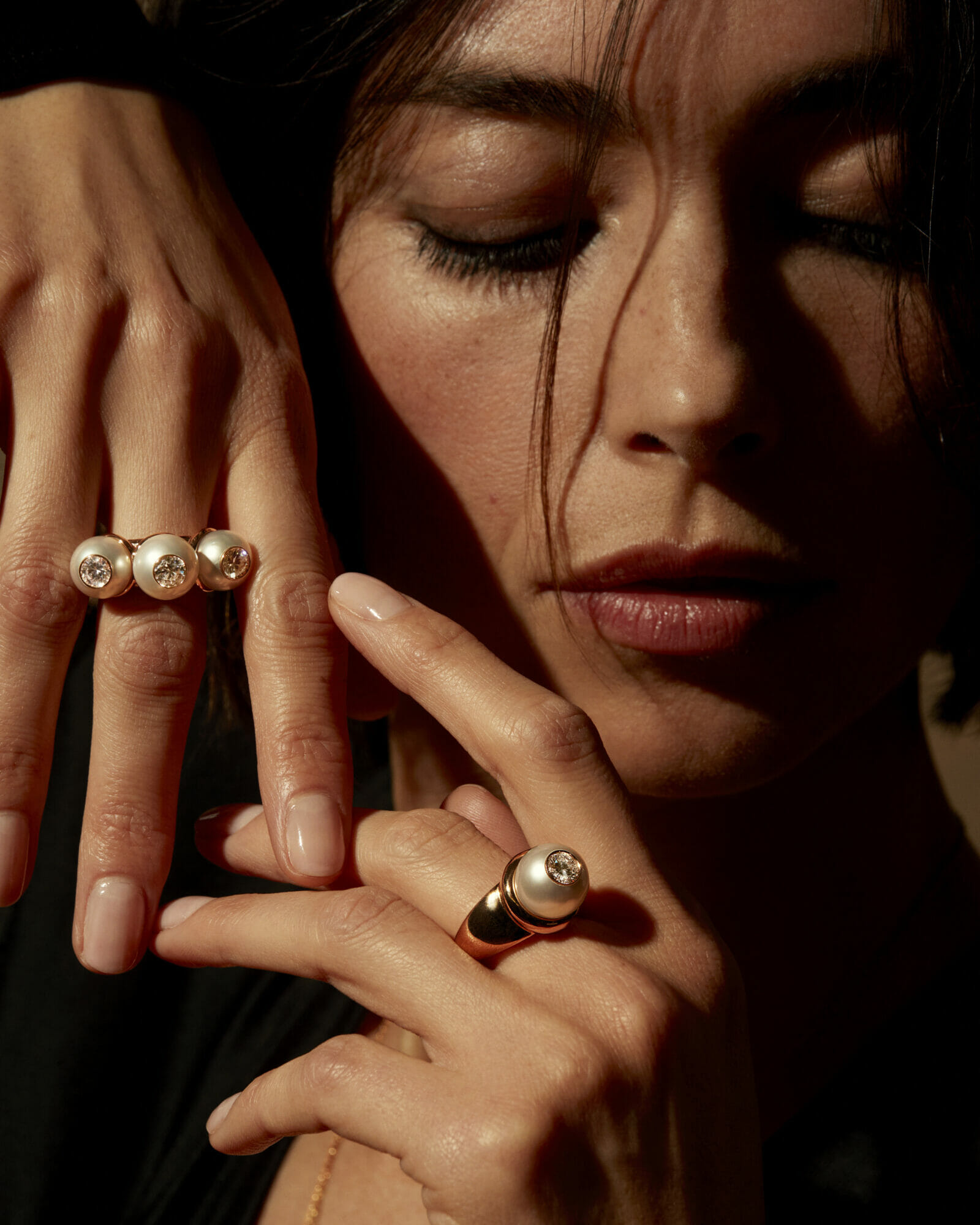 Diamonds and pearls, woman wearing pearl rings