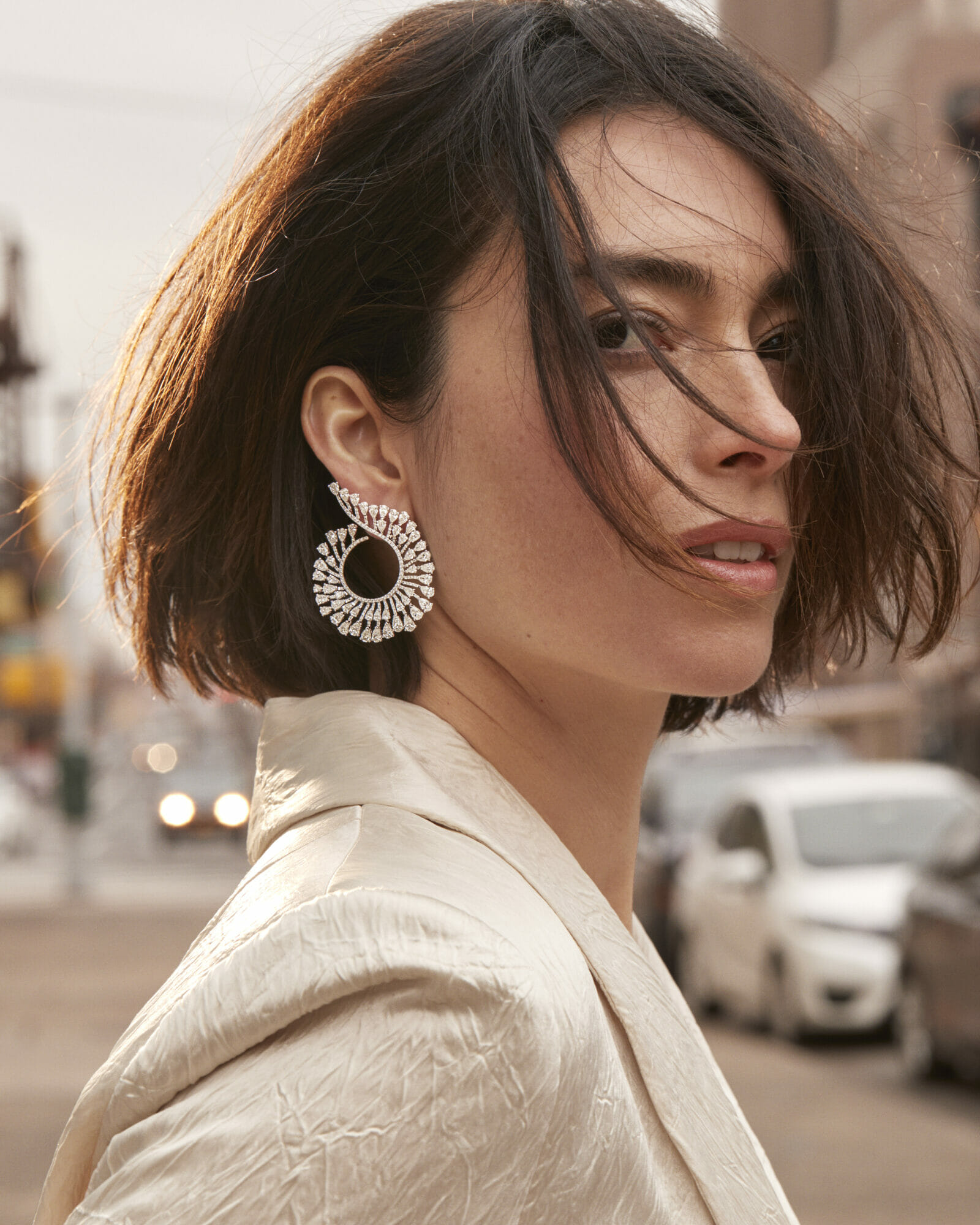 New hoops, woman wearing curve diamond hoop earrings