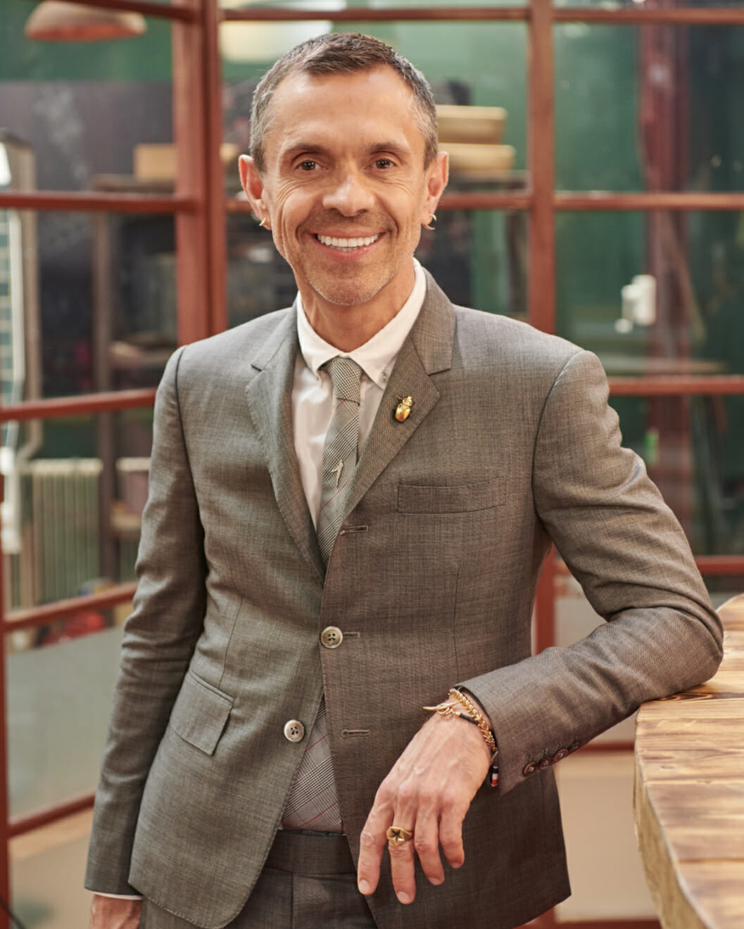 British jewelry designer Shaun Leane in a tailored suit.