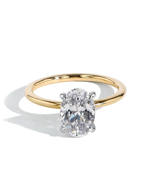 How to Make an Engagement Ring Look Bigger: 9 Designer-Approved Hacks 19 solitiare engagement ring with thin band