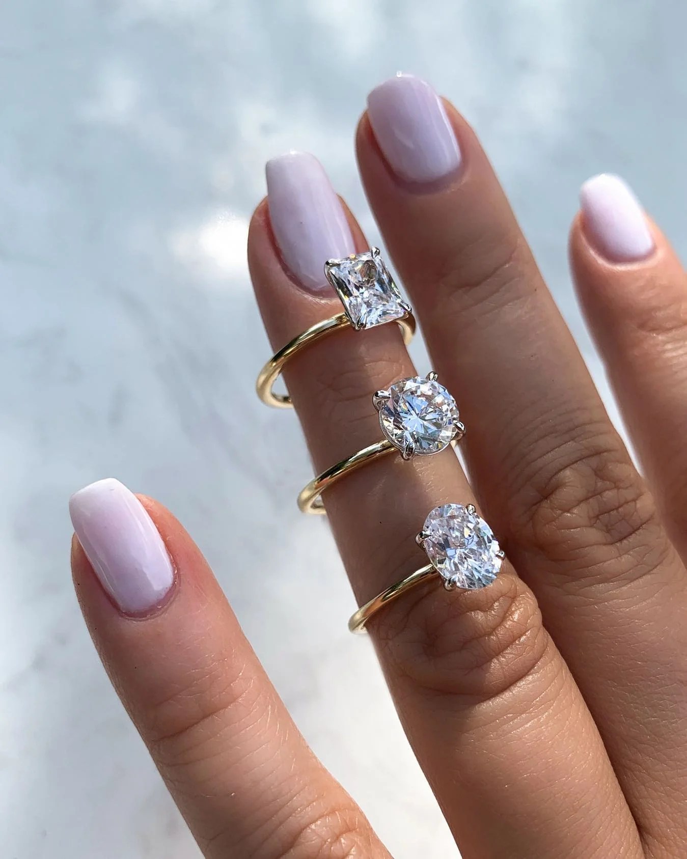 How to Make an Engagement Ring Look Bigger: 9 Designer-Approved Hacks 18 Solitaire diamond engagement rings with thin bands. (Courtesy of JR Dunn)