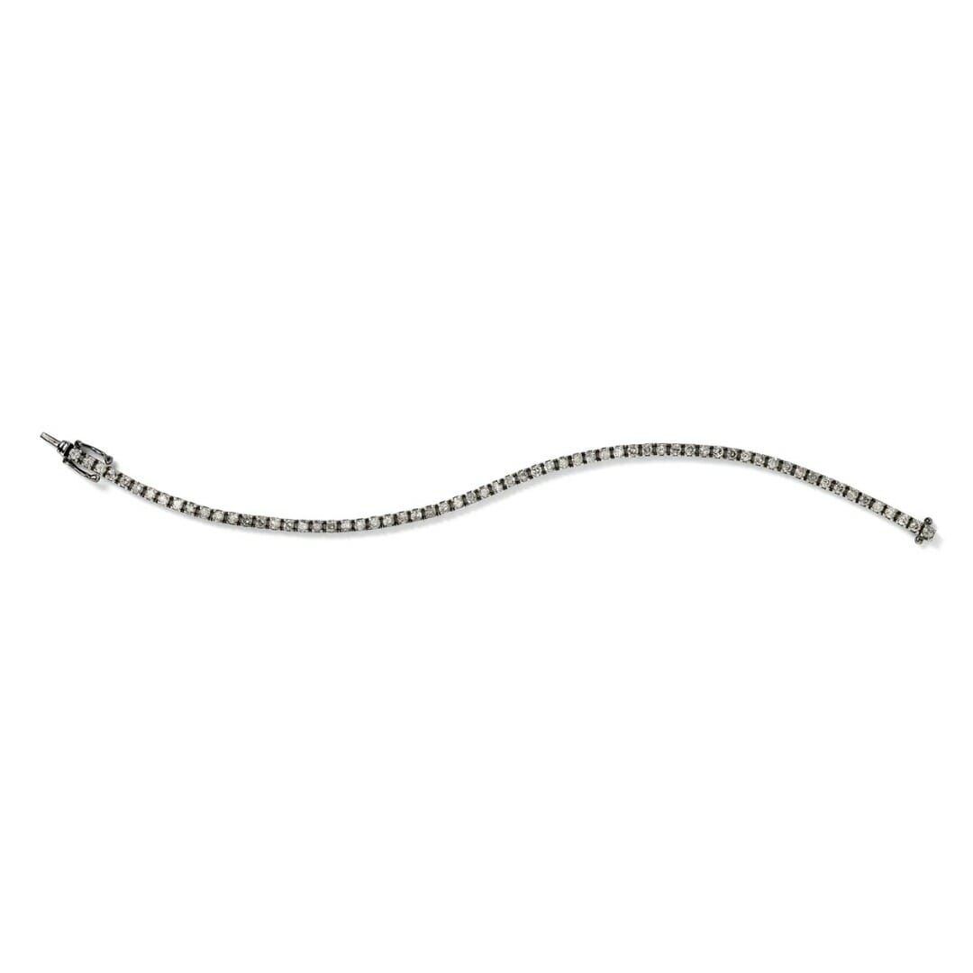 The History of Natural Diamond Tennis Bracelets and 10 Must-Have Pieces 7 Eva Fahren 18K BLACKENED WHITE GOLD WITH GREY DIAMONDS