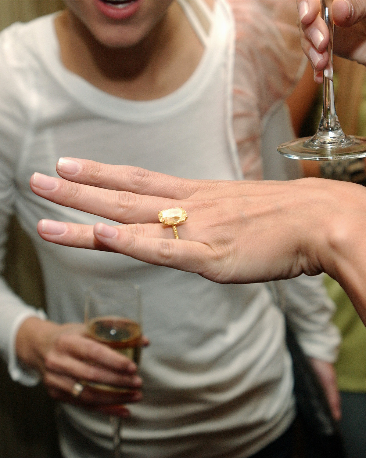 Heidi Klum showing her yellow diamond engagement ring 