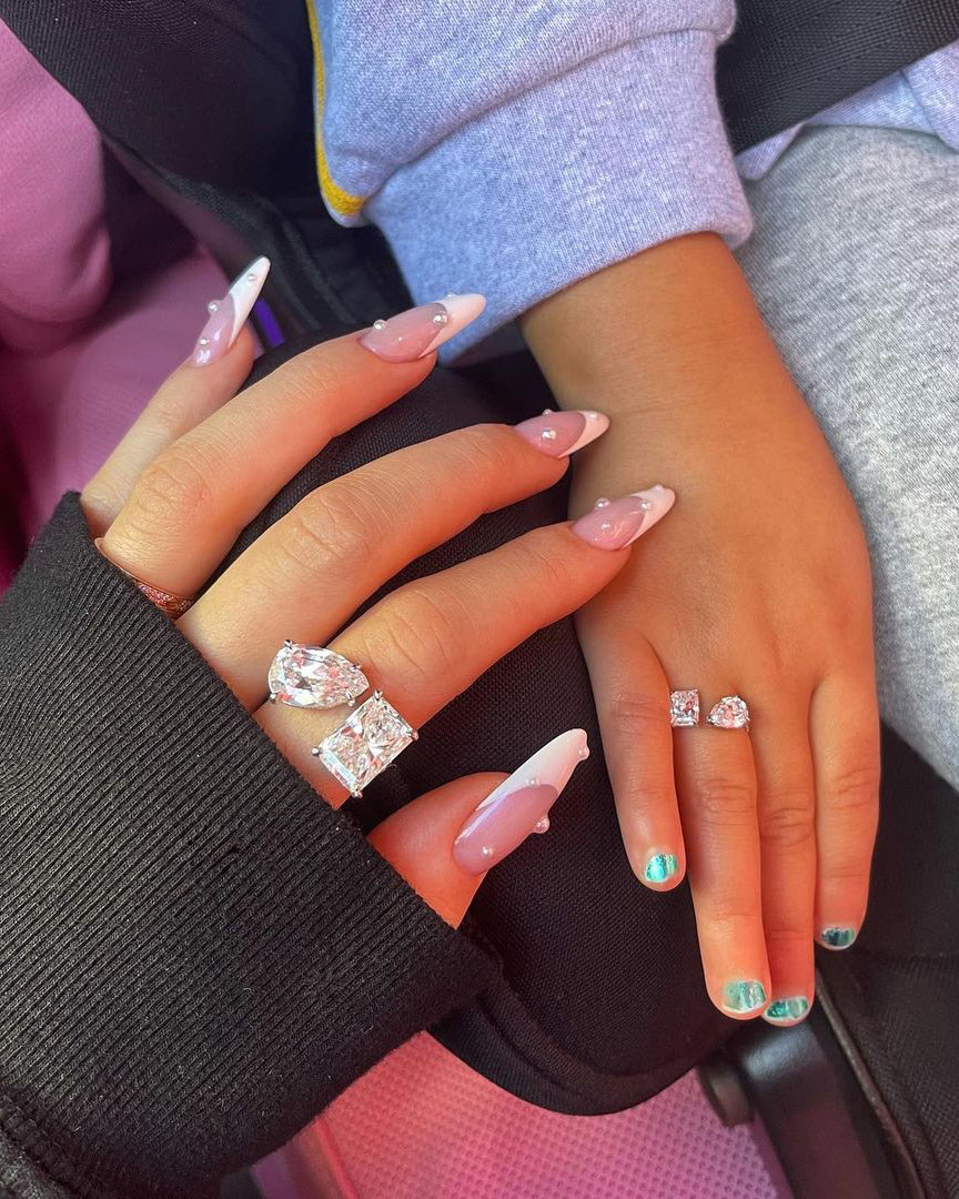 8 Dazzling Diamond Moments From The Kardashian-Jenner Family 7 Kylie Jenner and Stormi Webster matching diamond rings