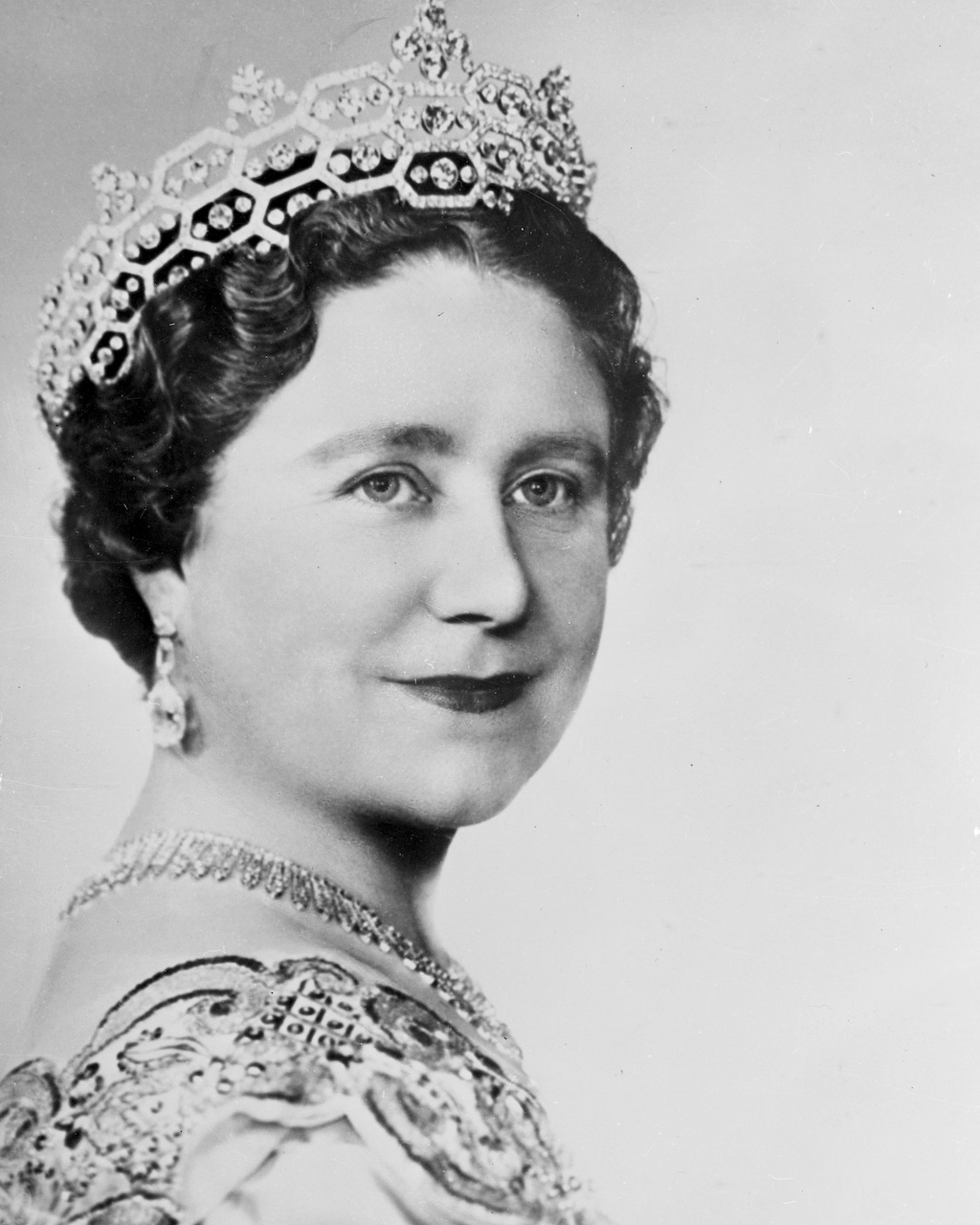 The Glorious Jewels of Queen Camilla 10 A portrait by Dorothy Wilding shows Britain's Queen Mother Elizabeth wearing the Greville Tiara.