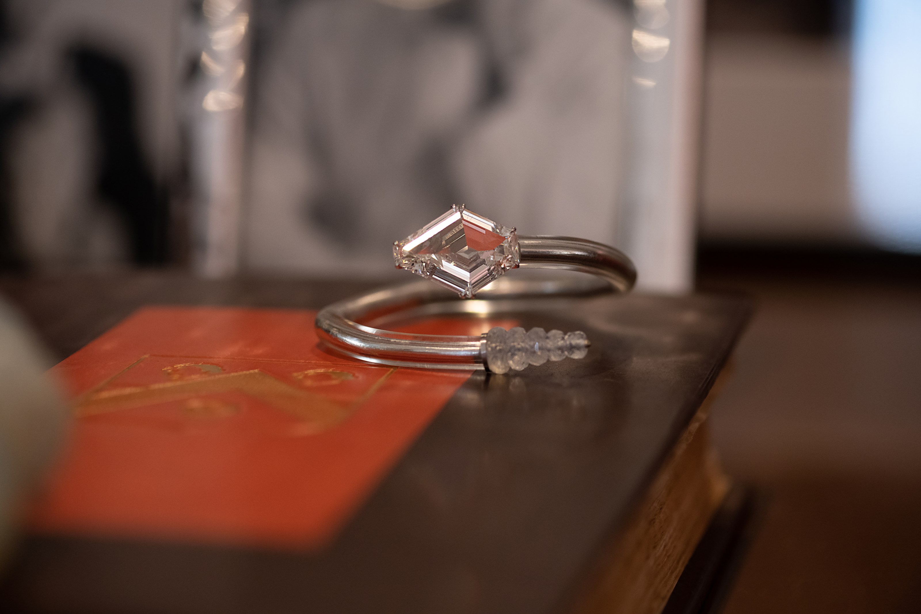 Taffin 12.32 carat kite-shaped diamond, moonstone bead, rubber and platinum bracelet.