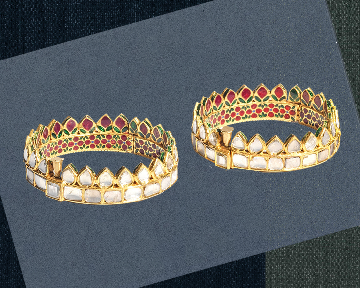 pair of gold bracelets embedded in diamonds