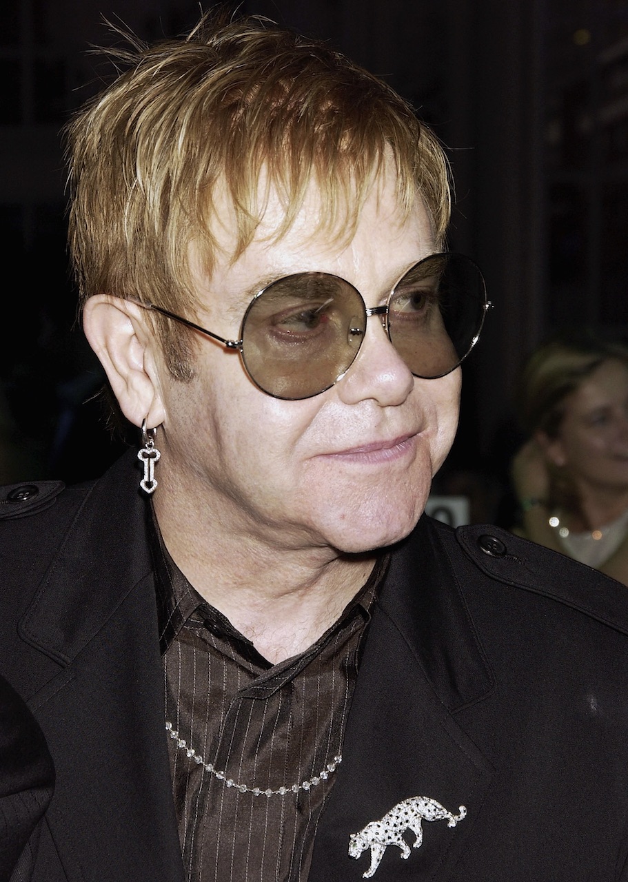 Sir Elton John wears a diamond Cartier Panthère brooch to attend the afterparty following the "GQ Men Of The Year Awards" at the Royal Opera House on September 7, 2004. (Getty Images)