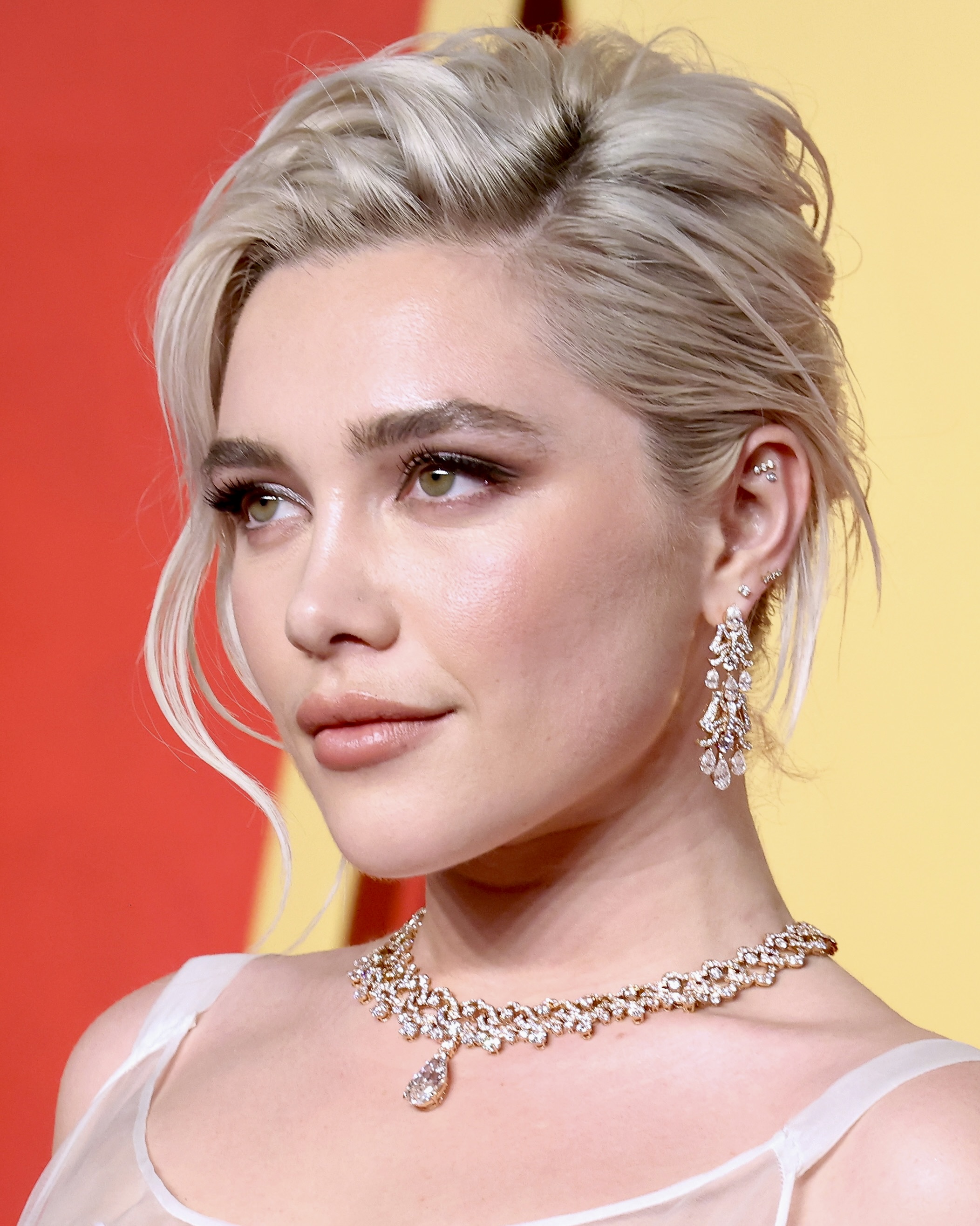 Florence Pugh attends the 2024 Vanity Fair Oscar Party, wearing a natural diamond jewelry set from Bulgari.