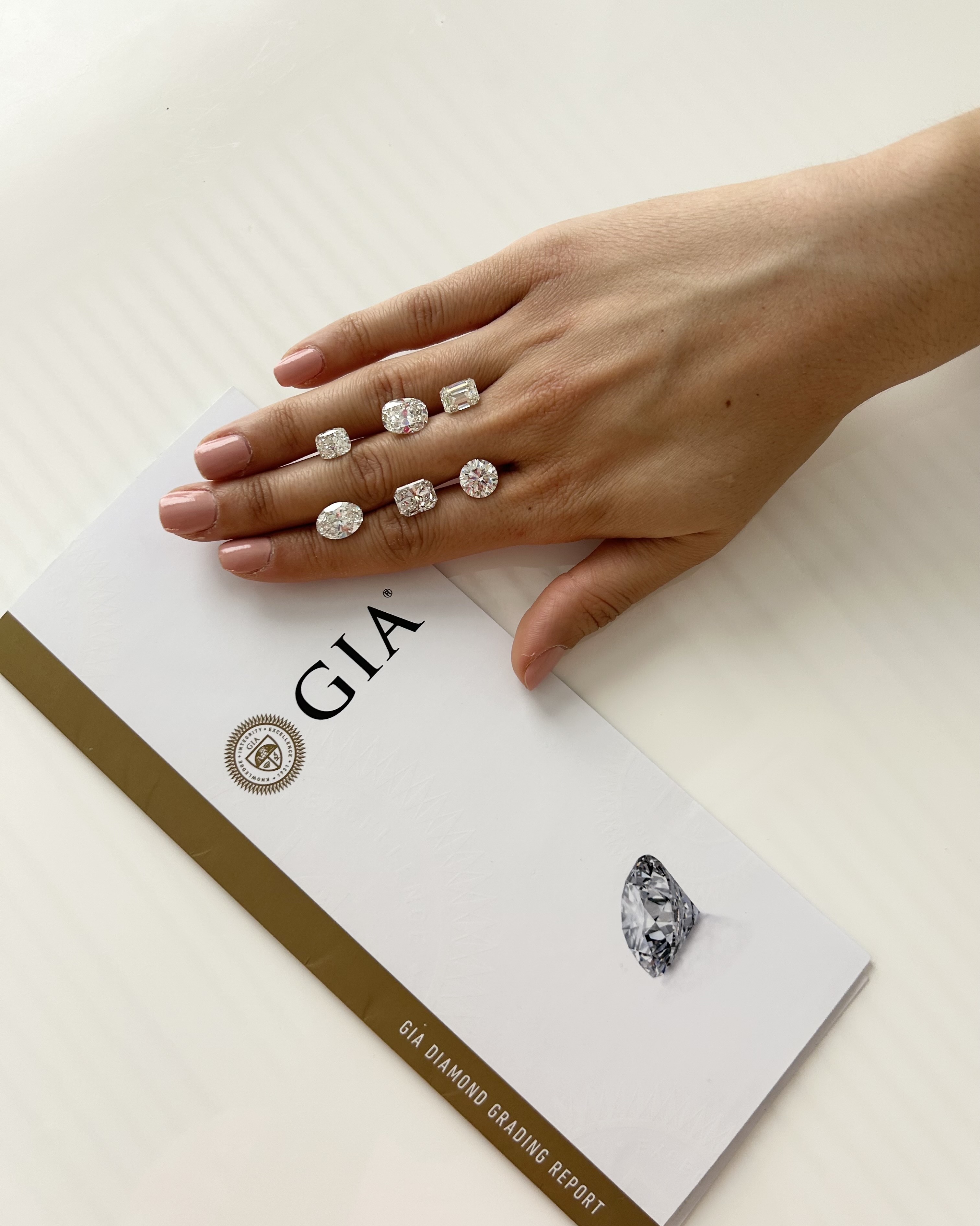 Diamonds Courtesy of The Clear Cut, Pictured with a GIA Diamond Grading Report (Only Natural Diamonds)