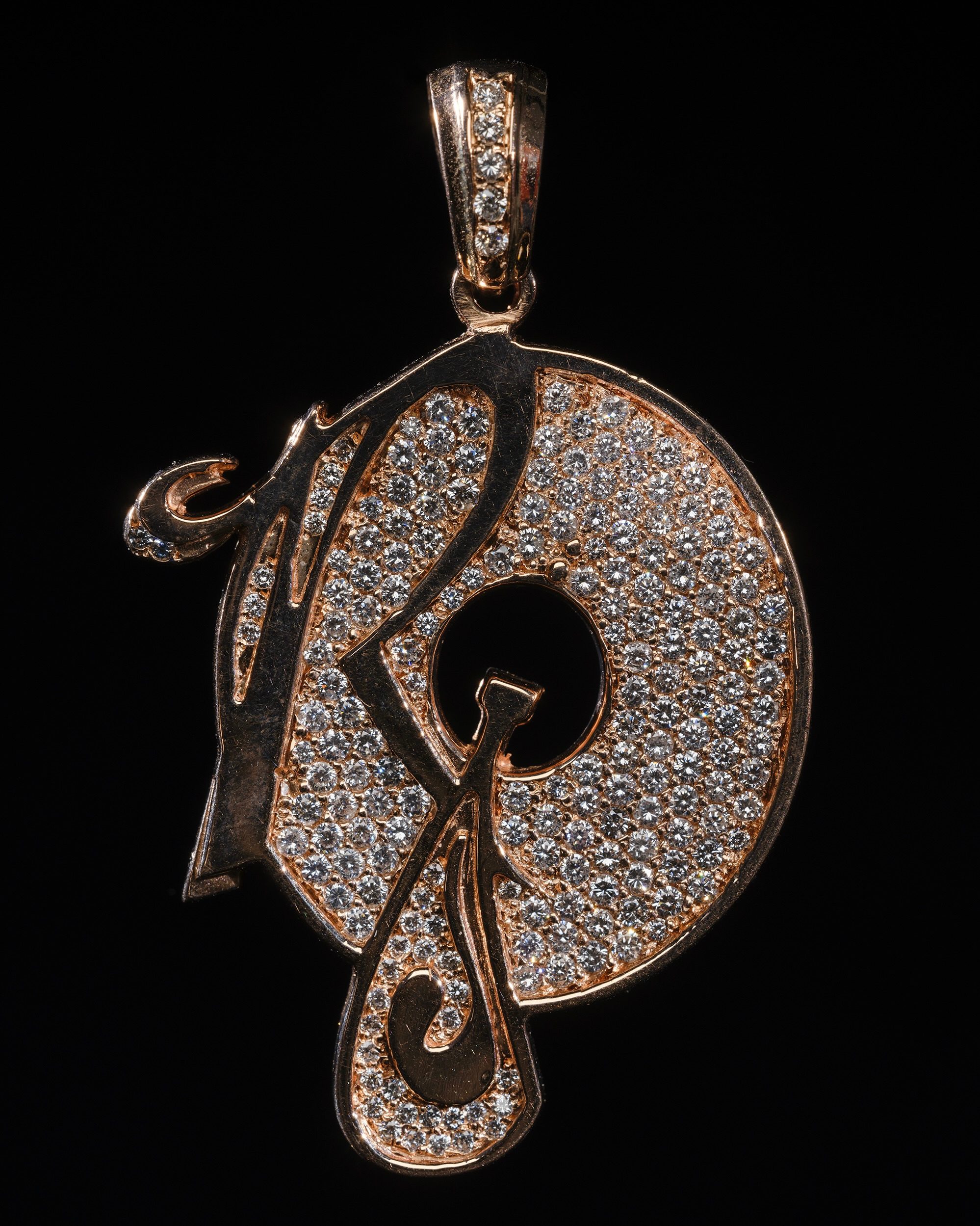 This rapper chains from Roc-A-Fella Records, the label founded by Jay-Z, Damon “Dame” Dash, and Kareem “Biggs” Burke, features a diamond-encrusted vinyl record with a bottle of champagne and a cursive “R,” and is among the most coveted of label chains.