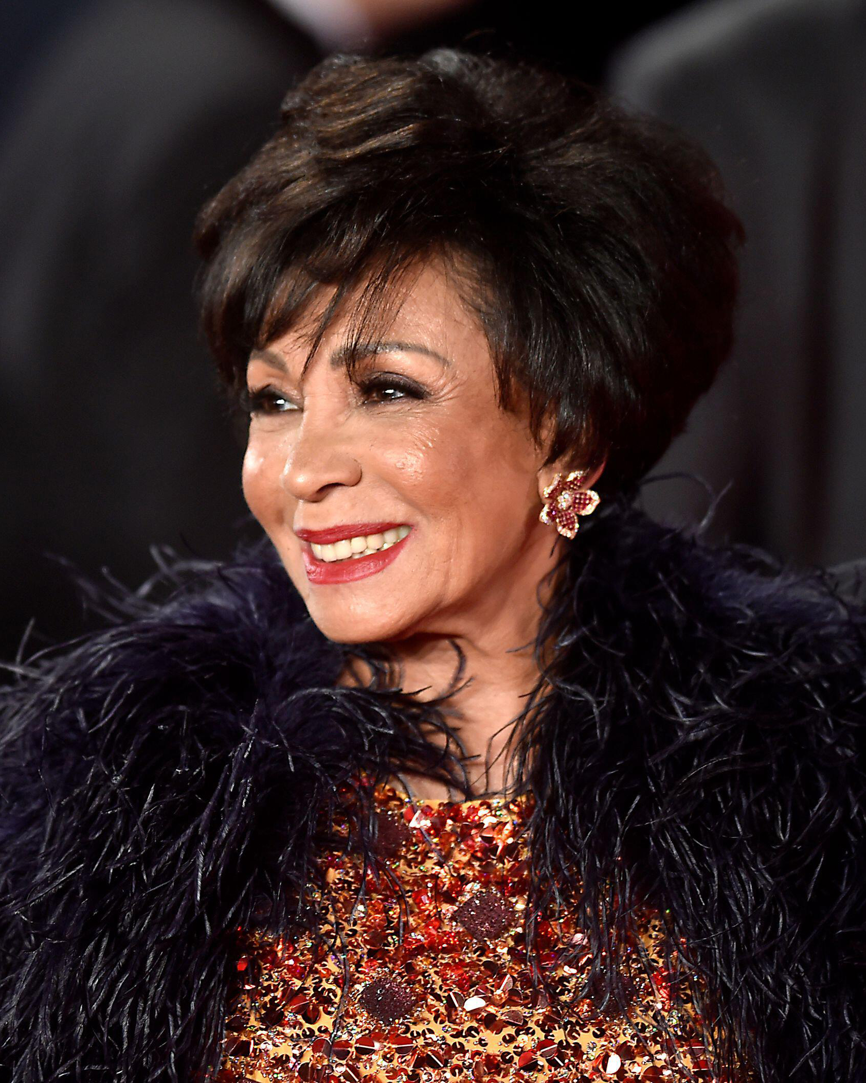 This image has an empty alt attribute; its file name is RARE_EPD_AUC_Shirley-Bassey-in-red-and-orange_IMG_4x5.jpg