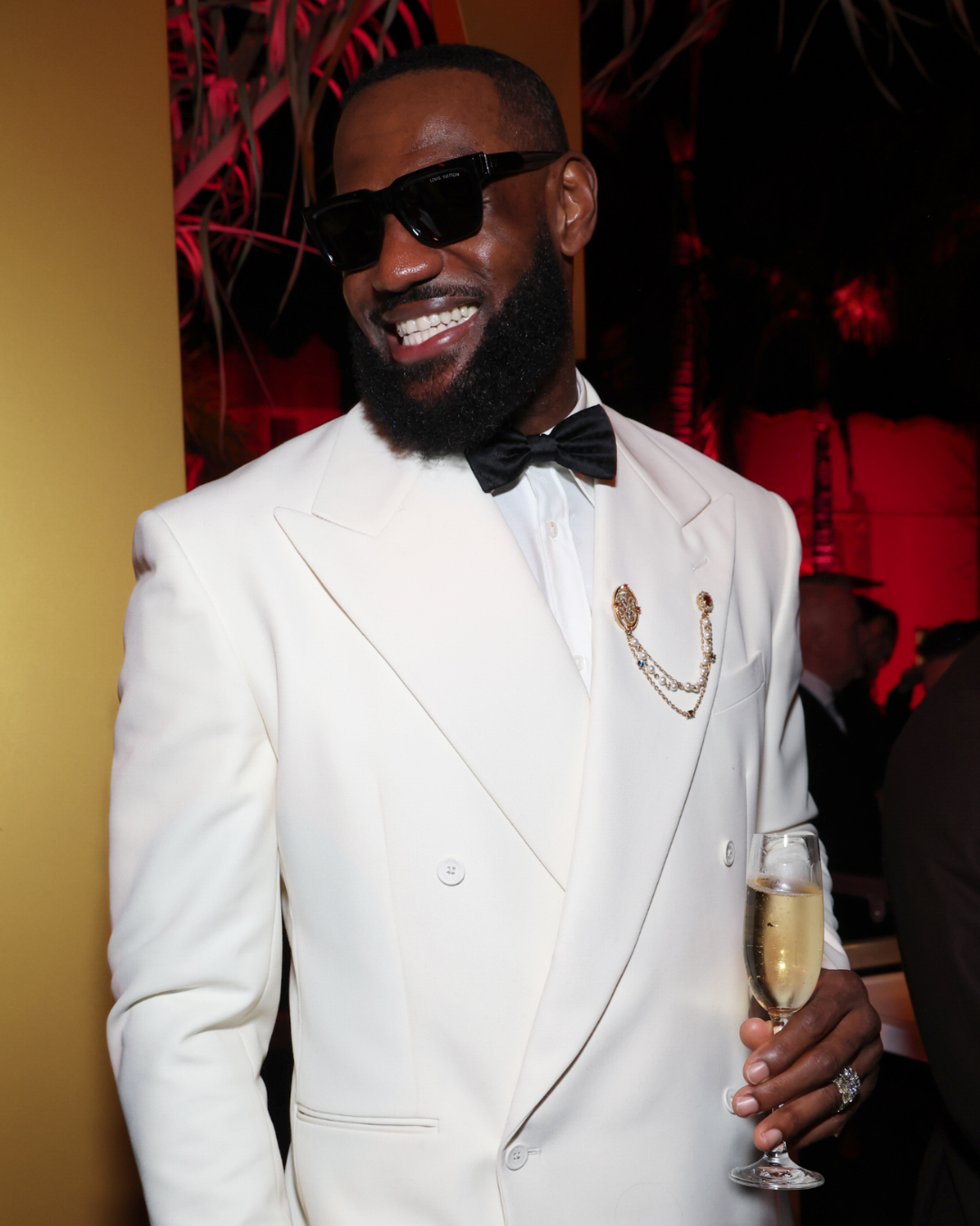 LeBron James wore a diamond and pearl lapel pin at the 2024 Vanity Fair Oscar Party, exemplifying the modern dandy style. He will serve as honorary chair at the 2025 Met Gala.
