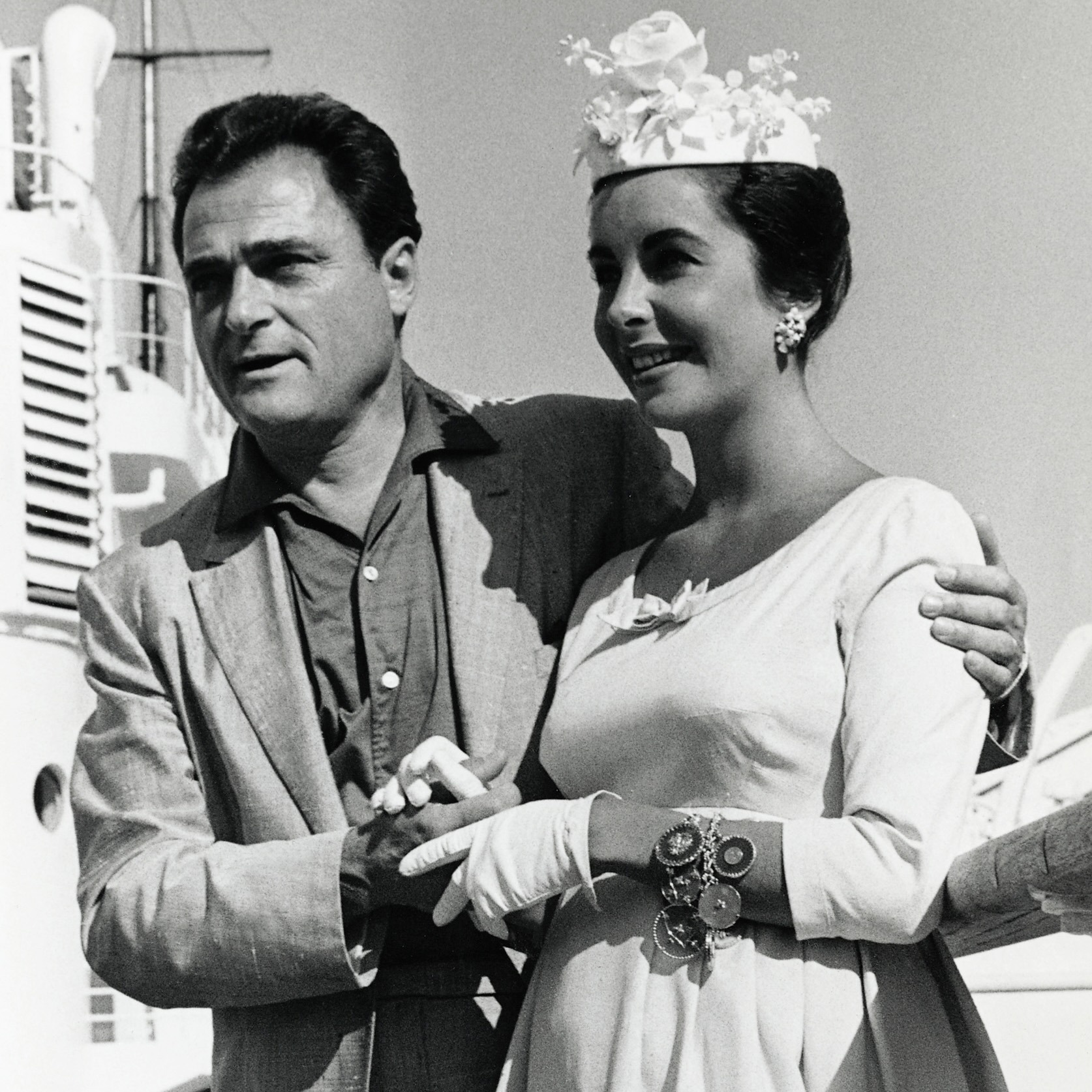 Elizabeth Taylor and her husband, Mike Todd. Taylor wears one of the several charm bracelets in her jewelry collection. (Getty Images)