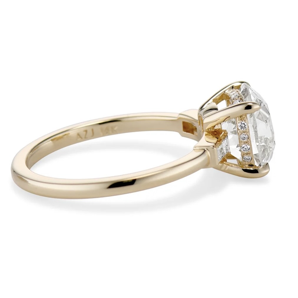 Why a Hidden Halo Engagement Ring Is the Ultimate in Understated Luxury 5 a diamond ring with a hidden halo setting