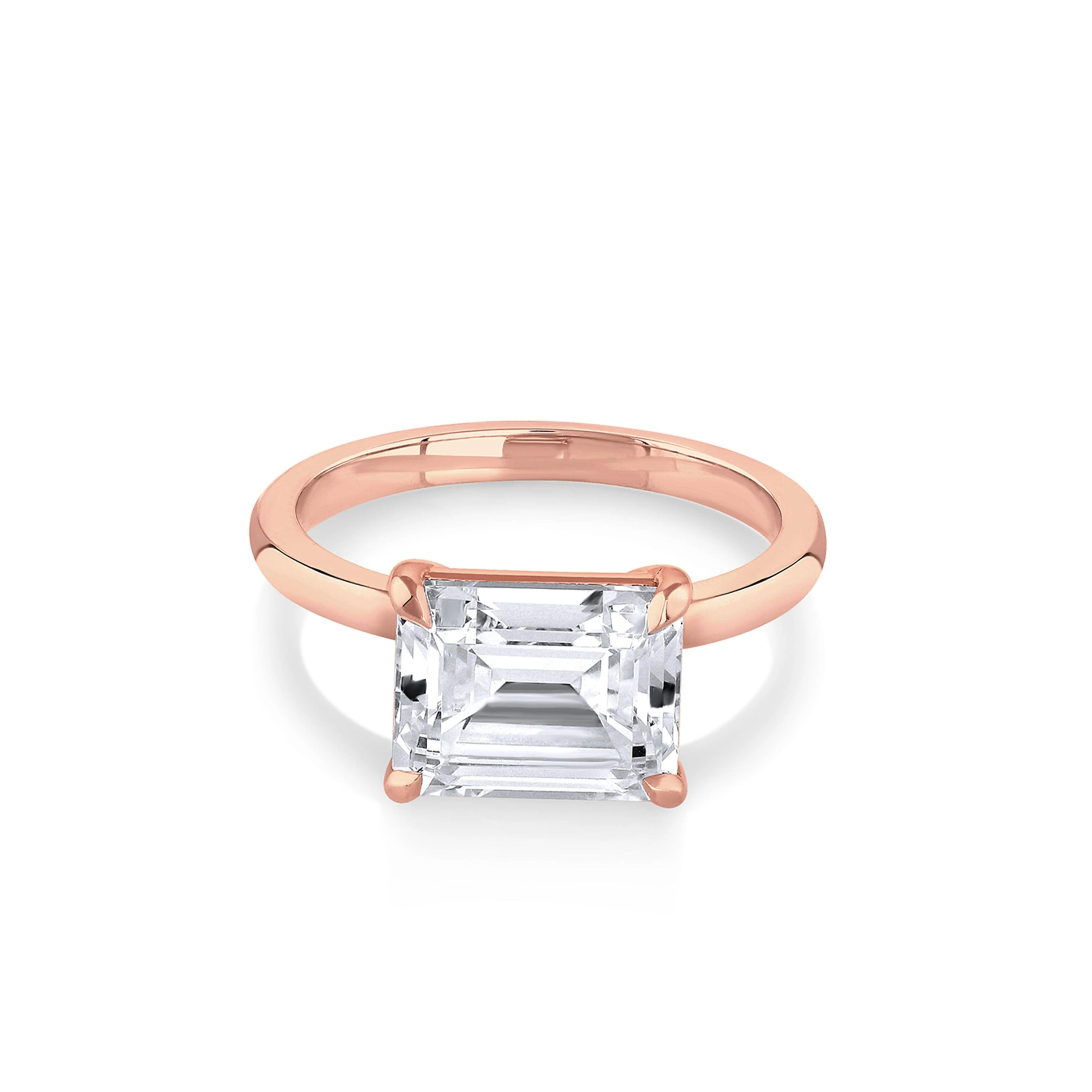 rose gold engagement rings: east west emerald cut engagement ring